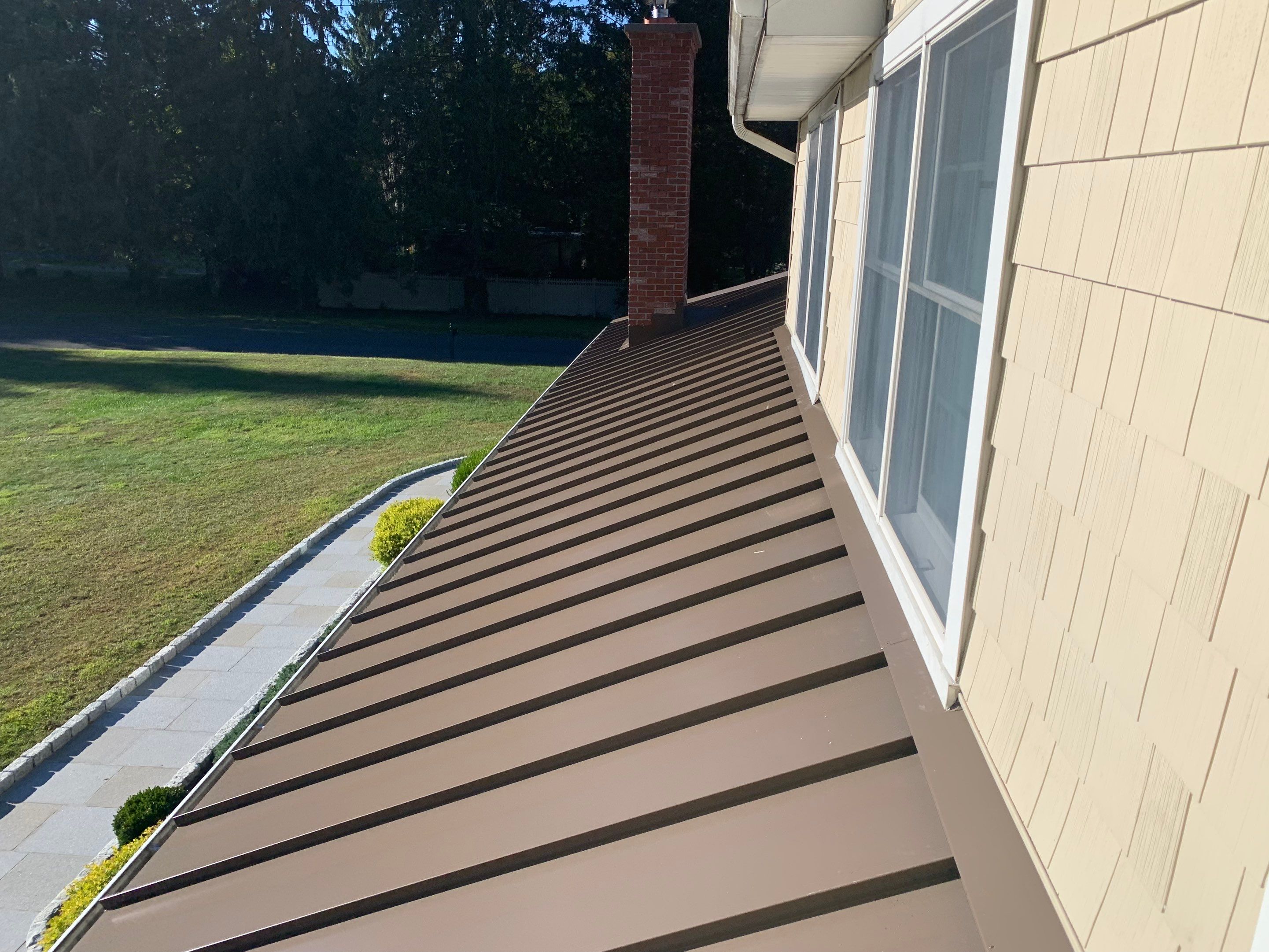 Asphalt & Standing Seam Metal Roof Replacement by Lecla Home Improvements and Roofing INC