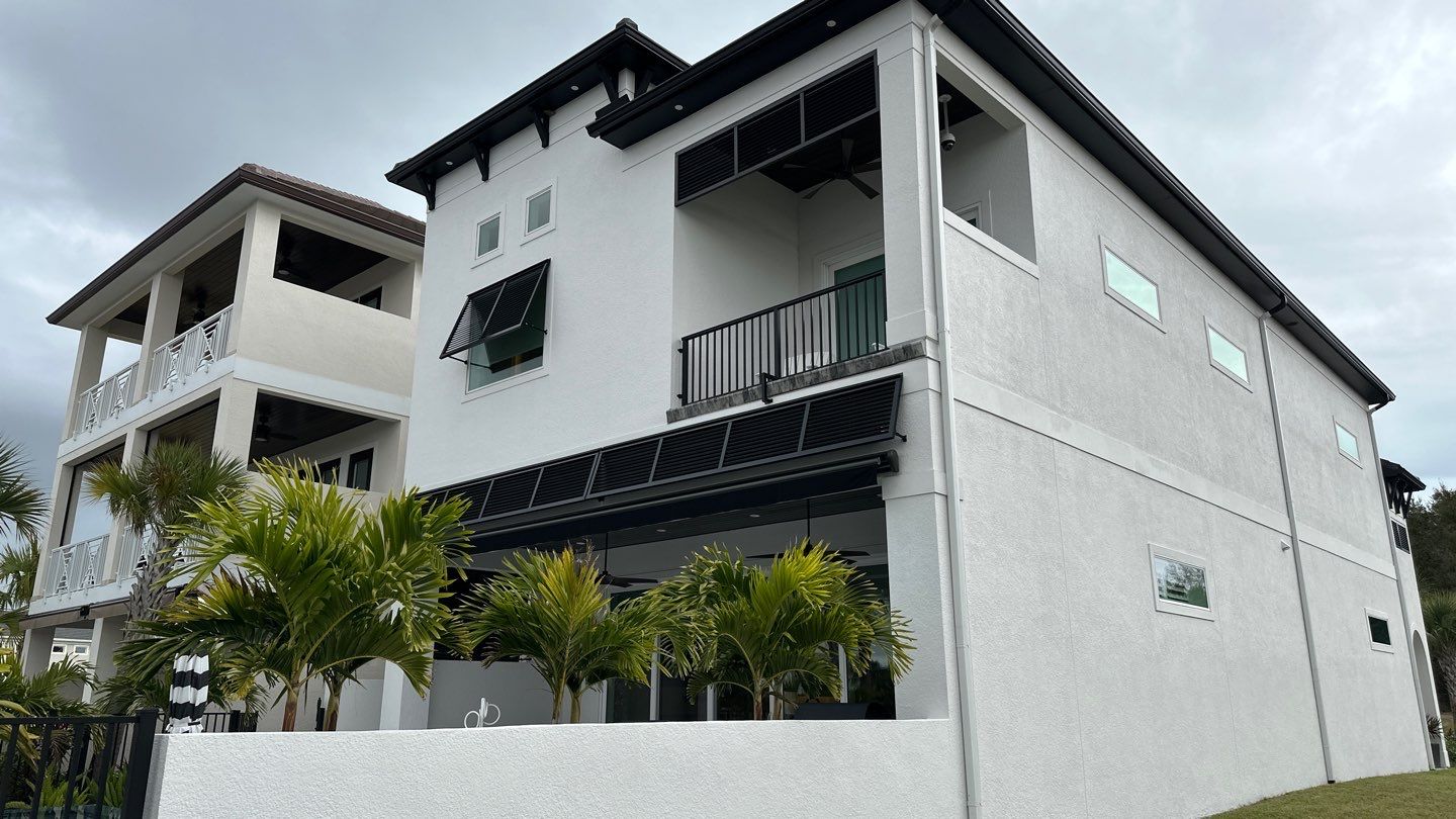 Bahama Shutters in Jet Black by Smart Guard Shutters