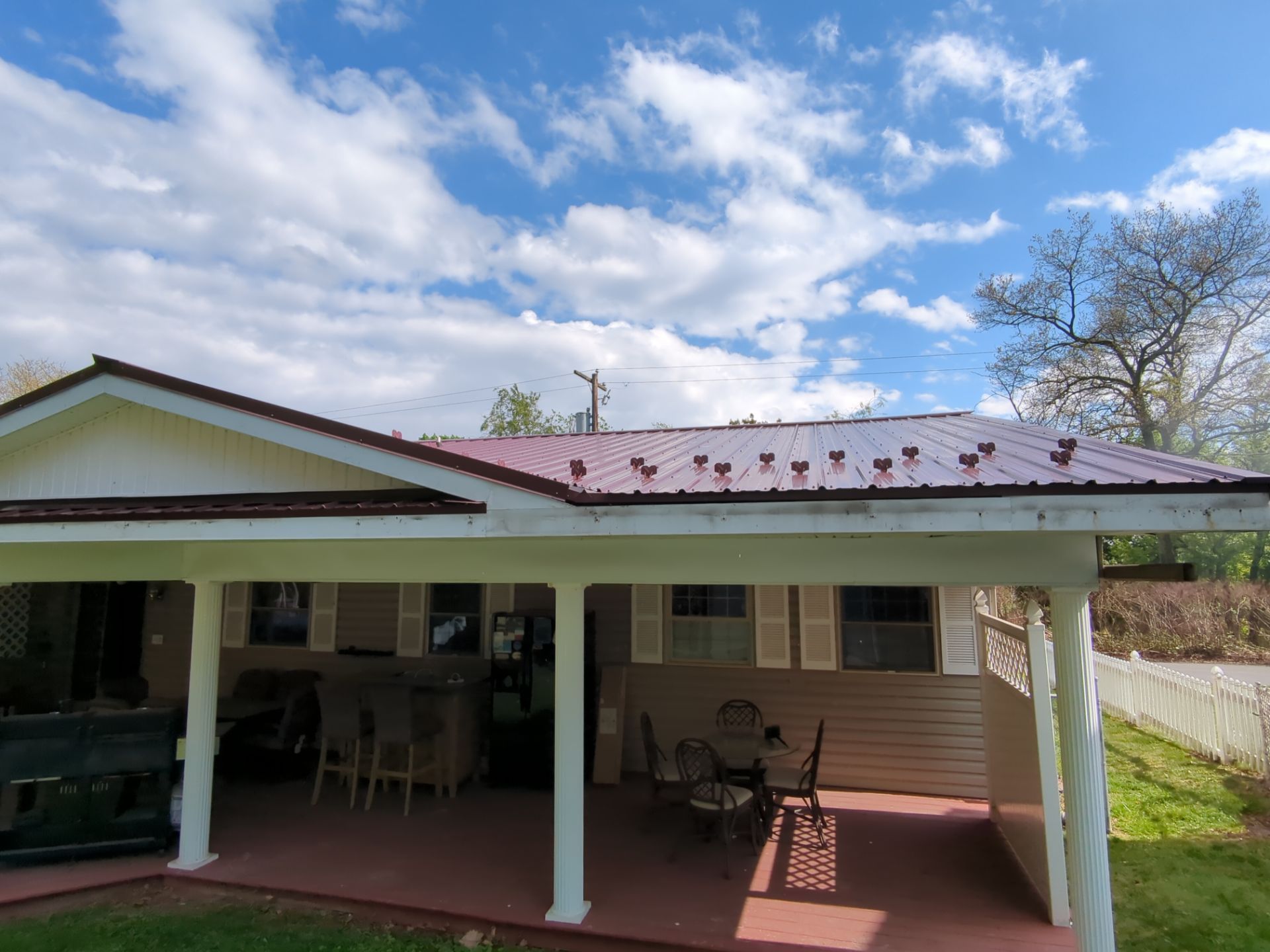 Maroon ABM Metal Roof Replacement and Gutter Installation in Shenandoah by Esh Builders