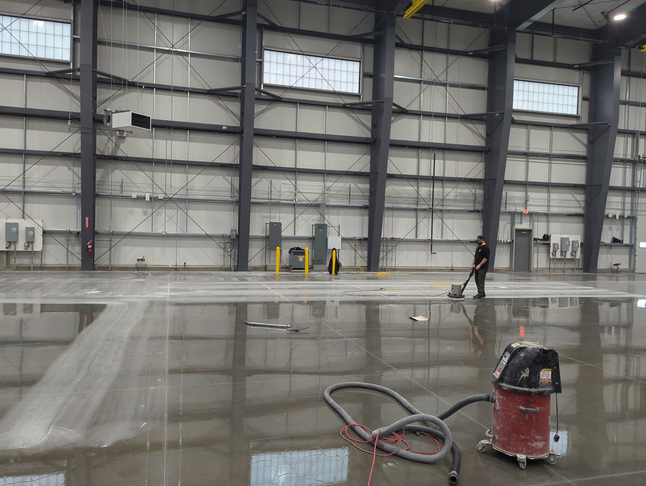 Airplane Hanger using Light Grey Commercial Penntek Epoxy by Croc Coatings, LLC