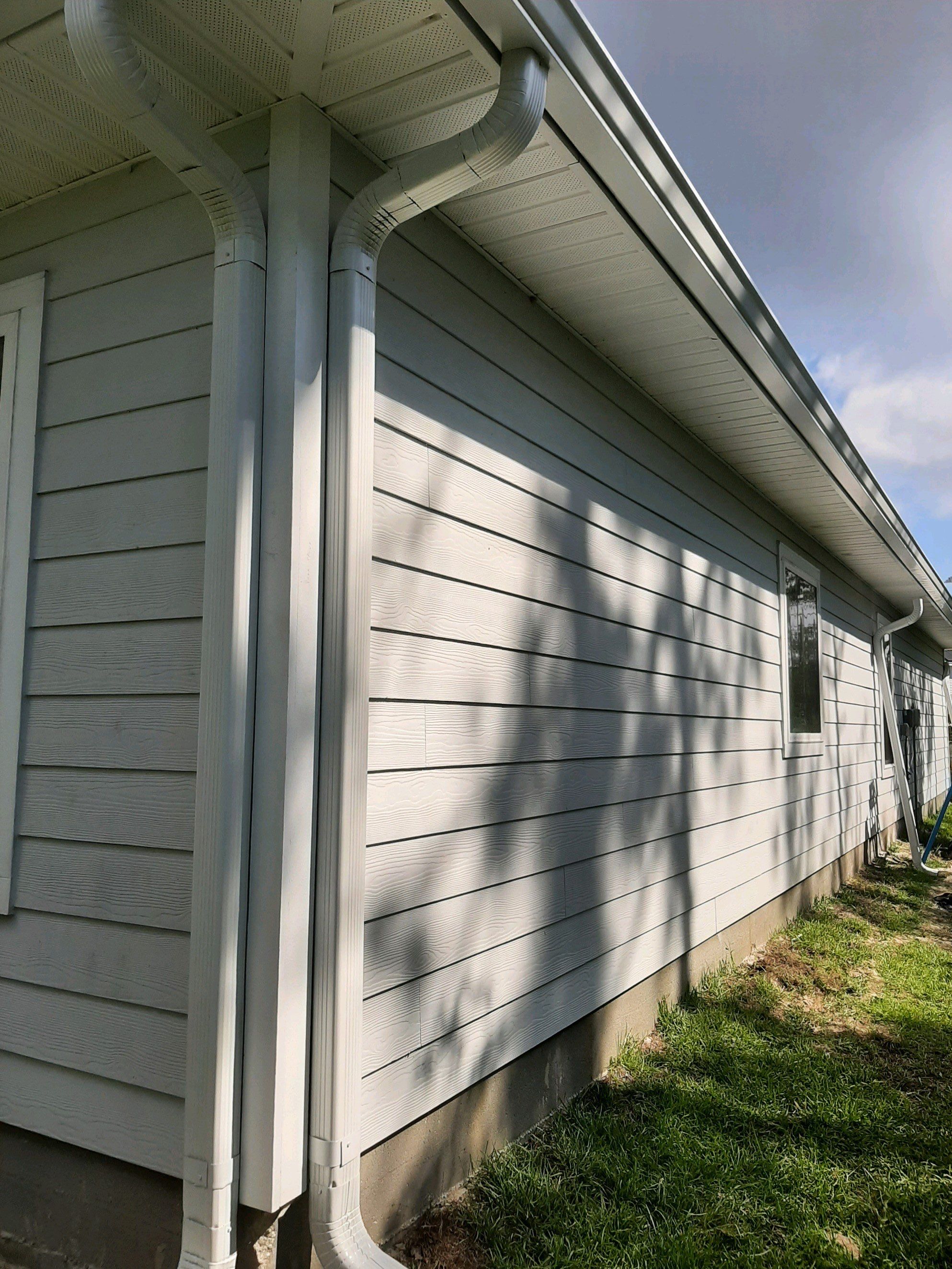 Seamless Gutter Installation using White by Gutter Professors