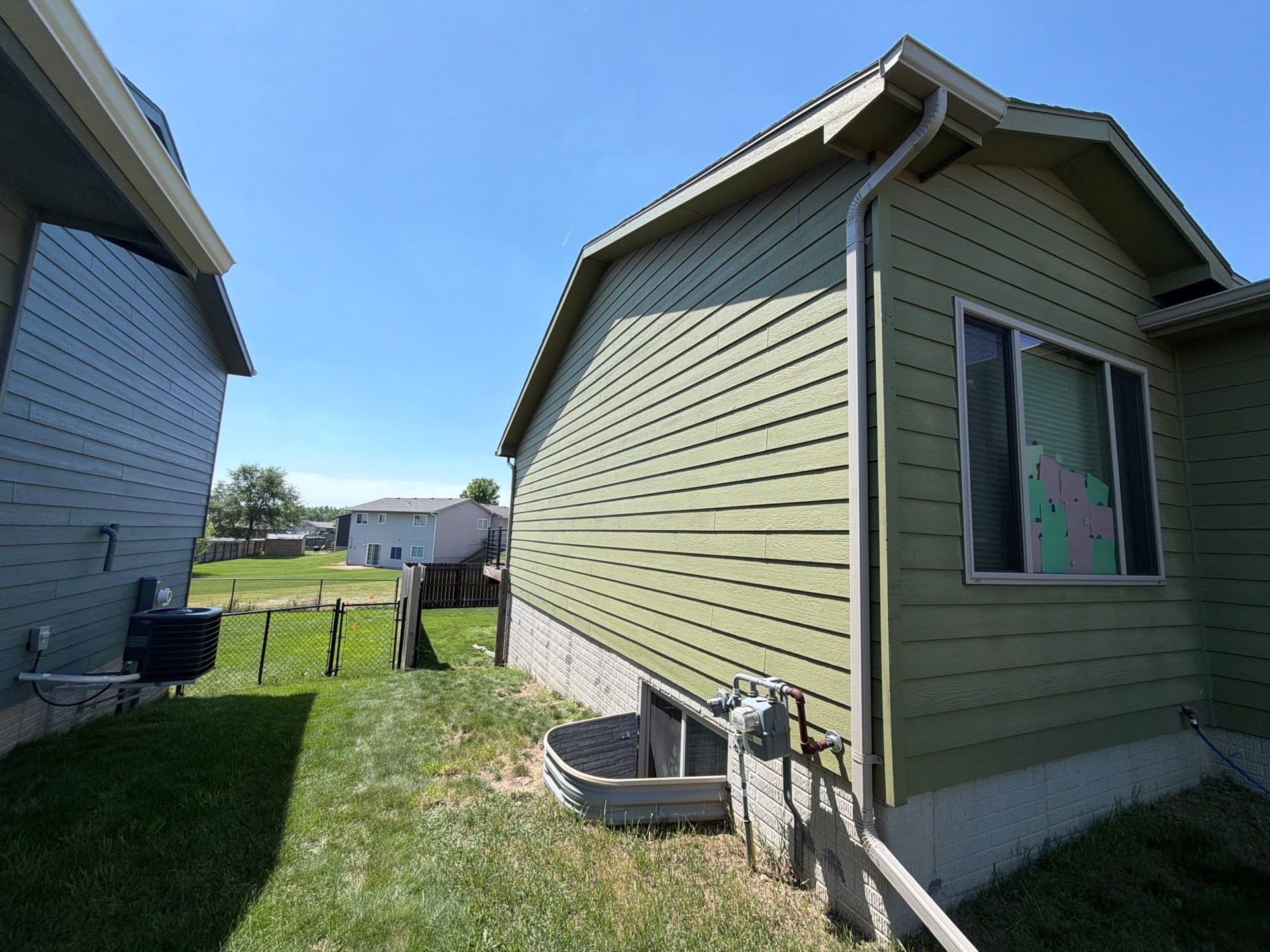 Exterior Painting and Custom Deck Construction in Sioux Falls by Select Painting, Coatings & Garage Cabinets