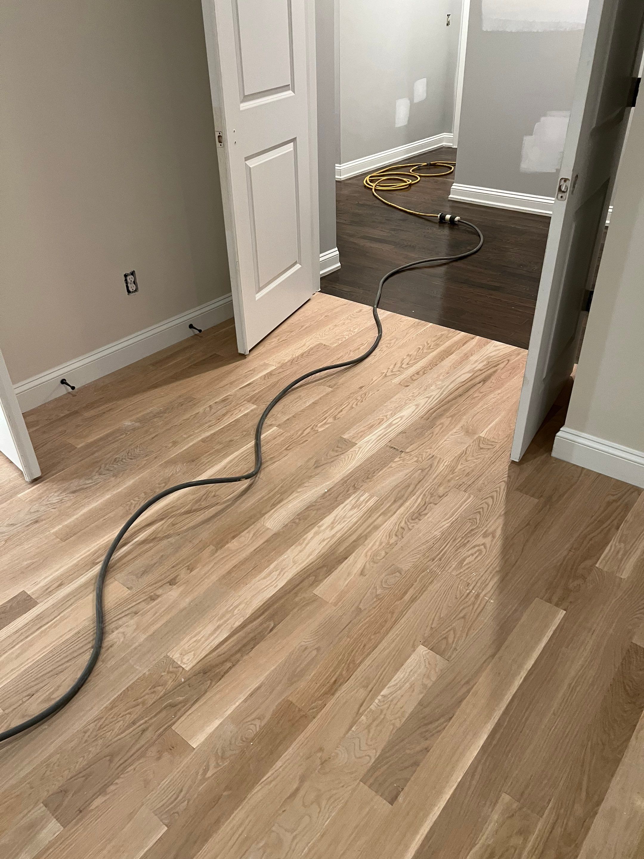 Adding hardwood floors to bedrooms by Accent Custom Floors
