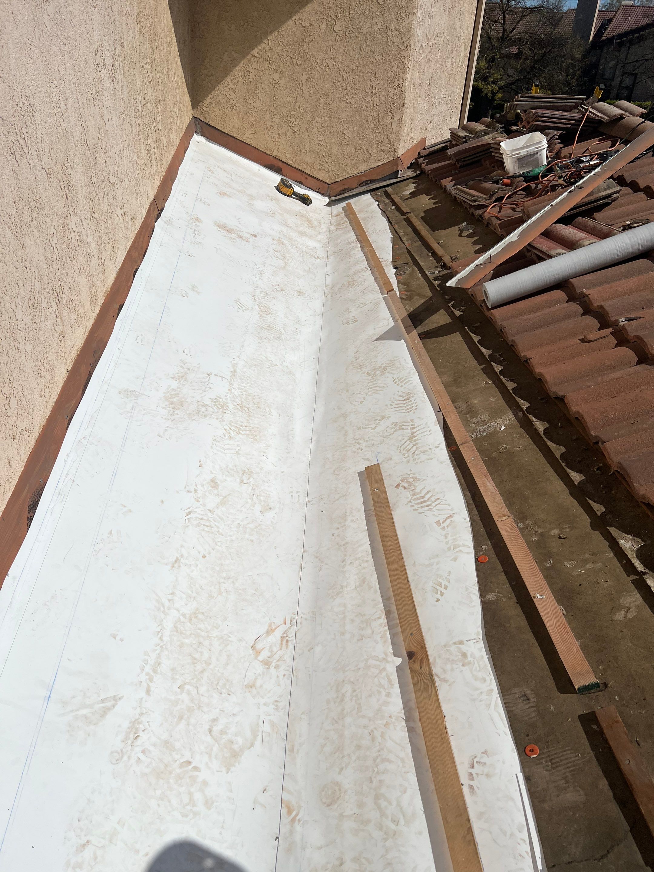 Tile Roof repair by Grandmark Service Company