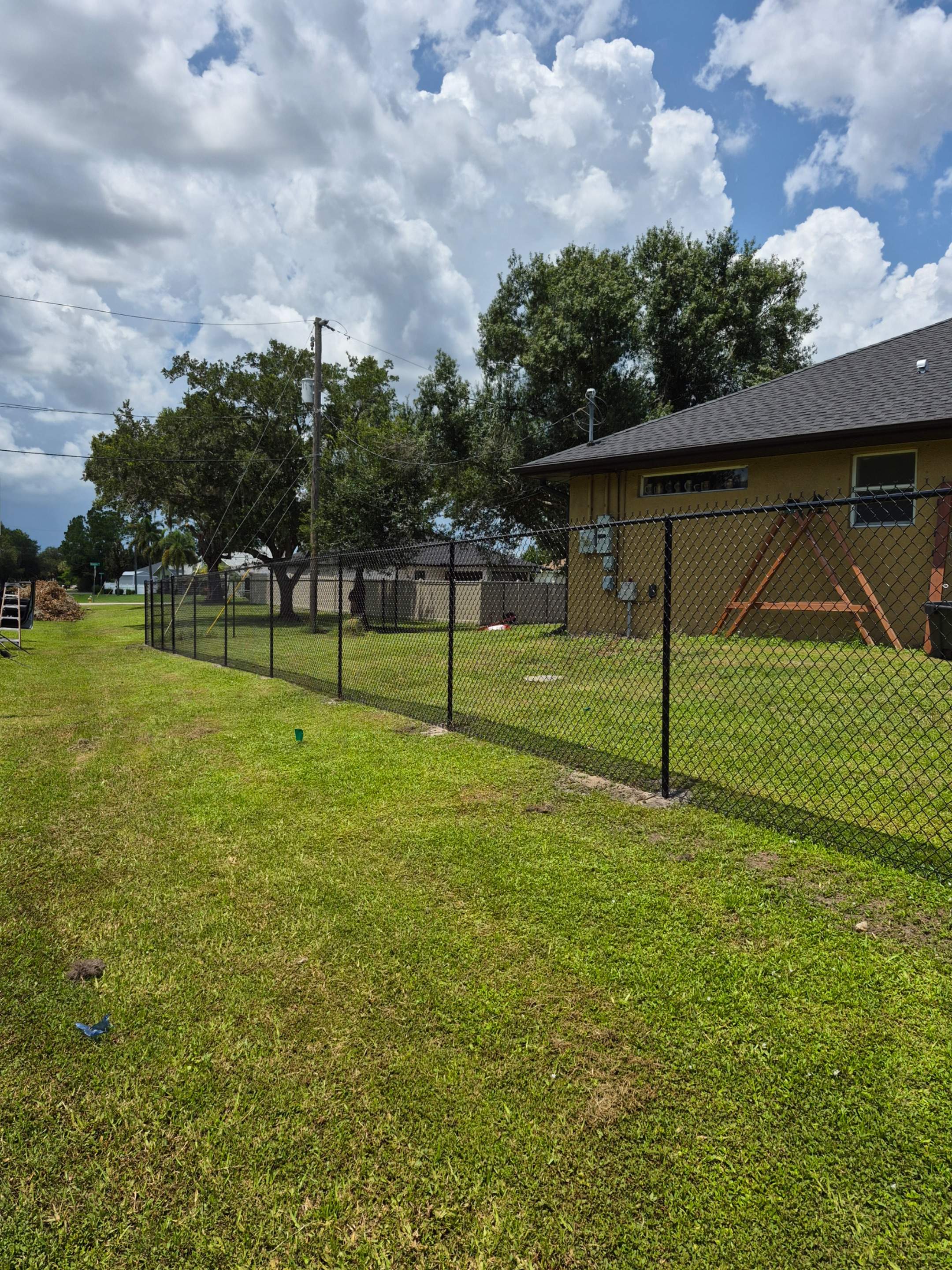 Black Chain Link Perimeter Fencing with Double Gates in Port Charlotte by True Fence LLC