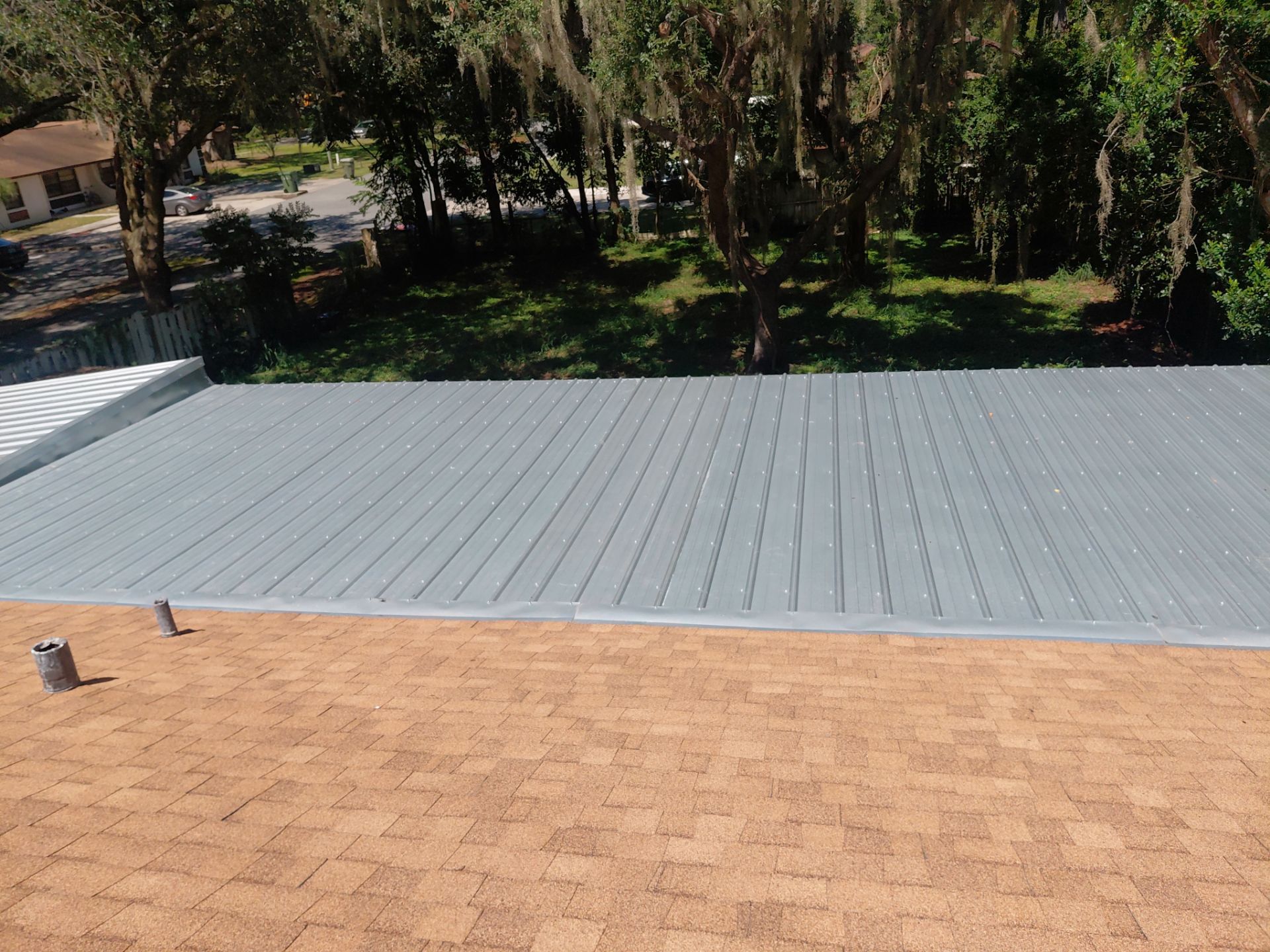 Combined Shingle and Metal Residential Roof Replacement in Leesburg Florida by Pinnacle Roofing Group