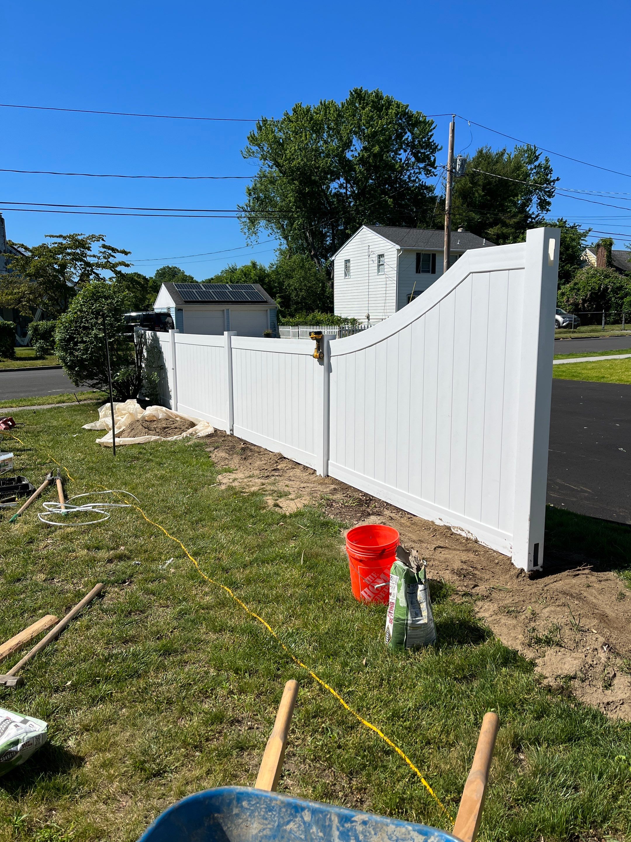Replacement Vinyl Privacy fence with Transition piece in White by DiGiorgi Roofing and Siding Inc