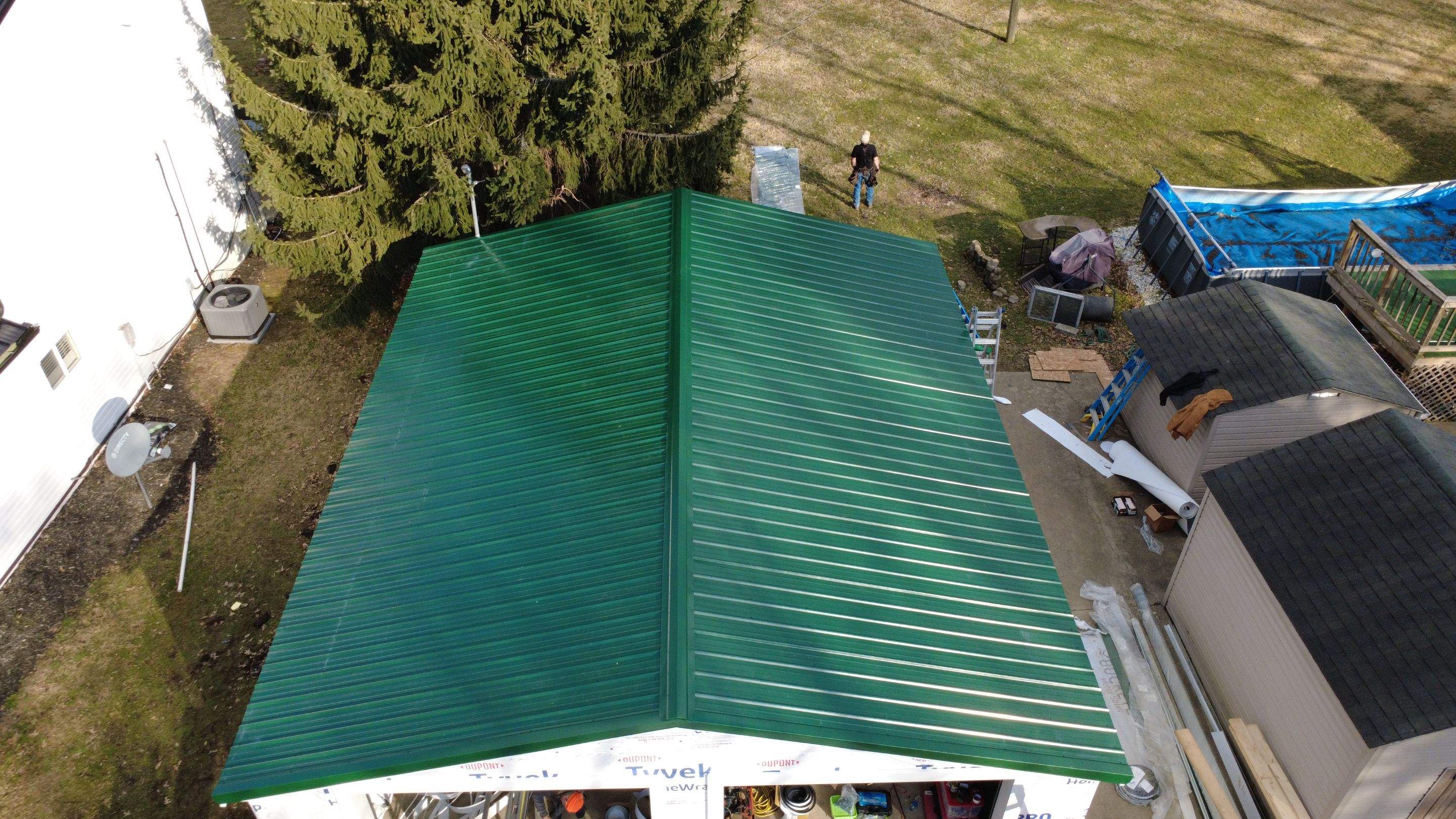 Green Metal Roof Installation and Exterior Renovation in Thornville by Canopy Contracting