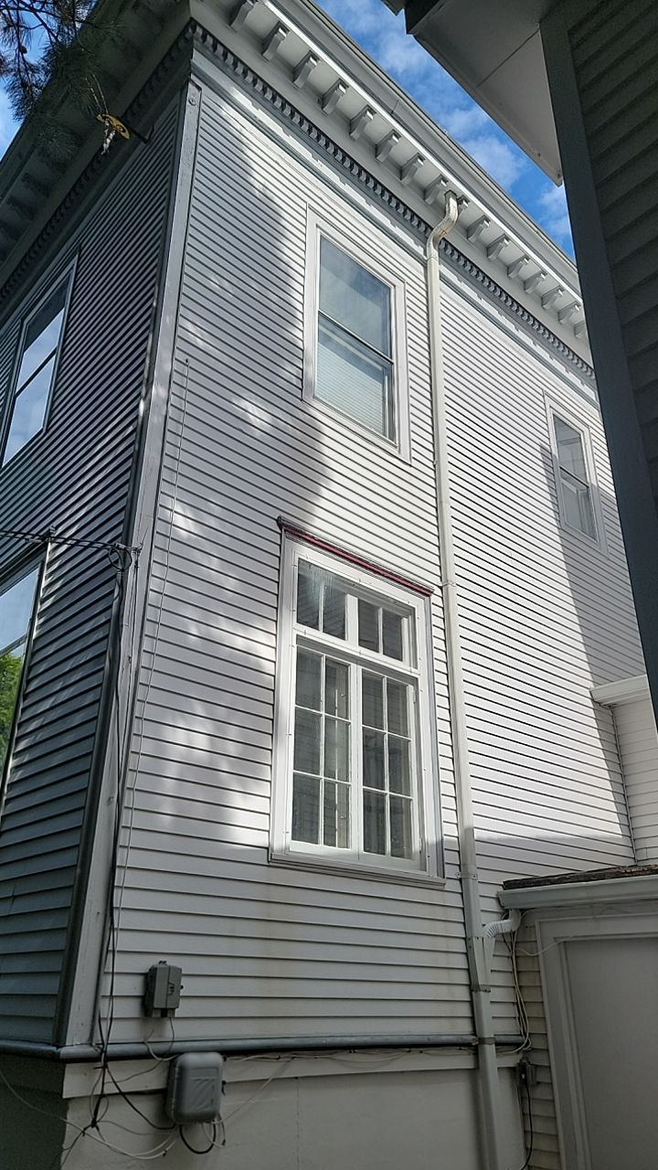 Housewashing  using Algaecide, soft wash soap by Northern Power Washing LLC.
