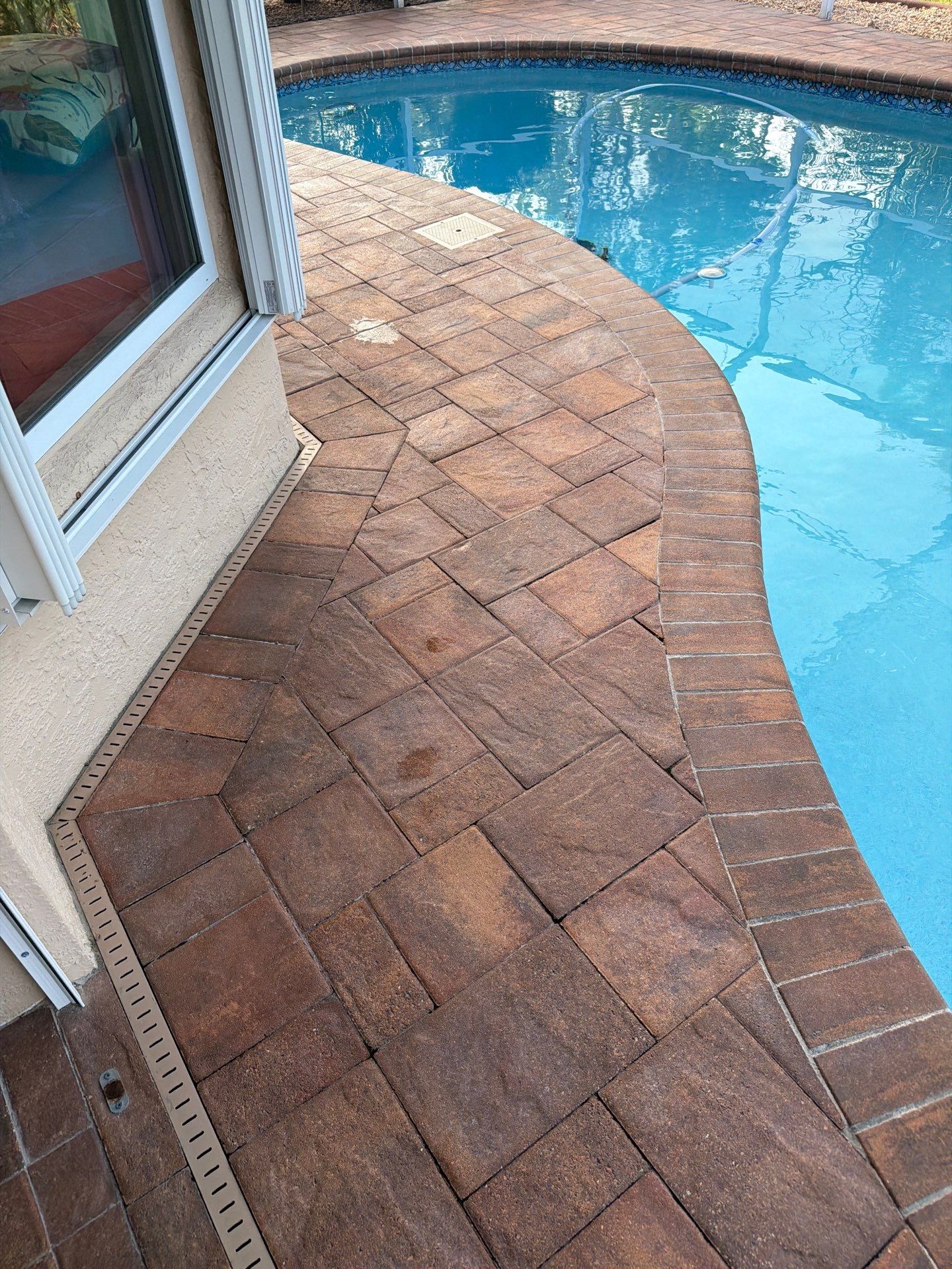 Paver Sealing and Striping for Sun City Center Pool Deck by Supreme Paver Experts