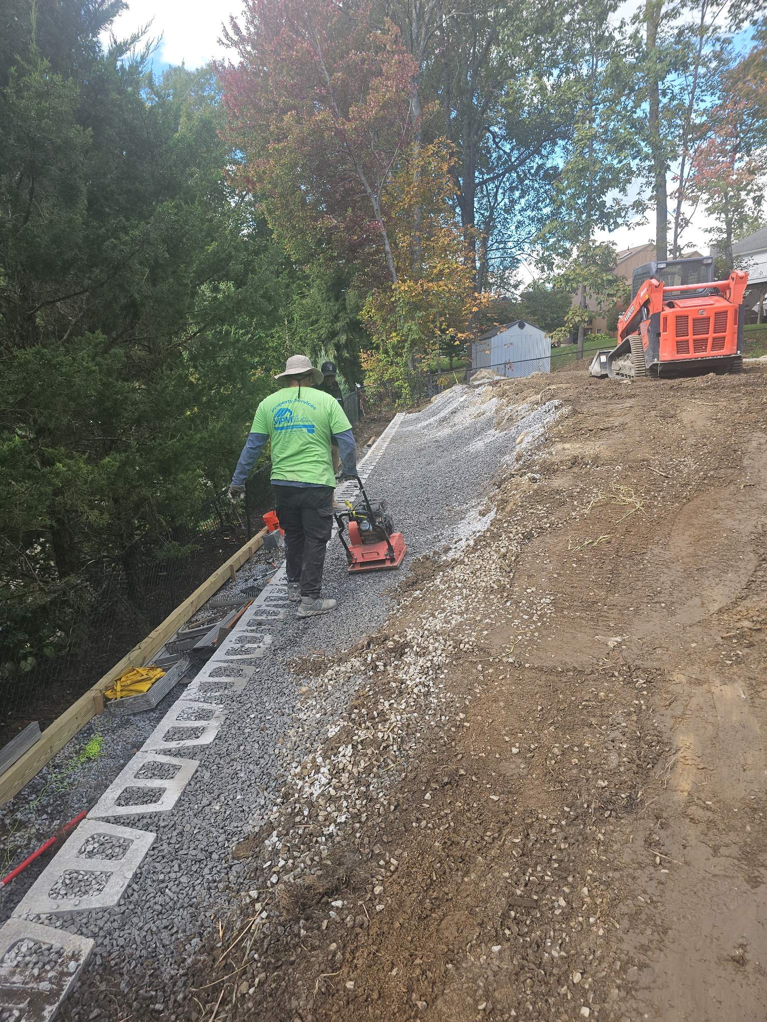 Retaining Wall to Level Backyard  by May Property Management 