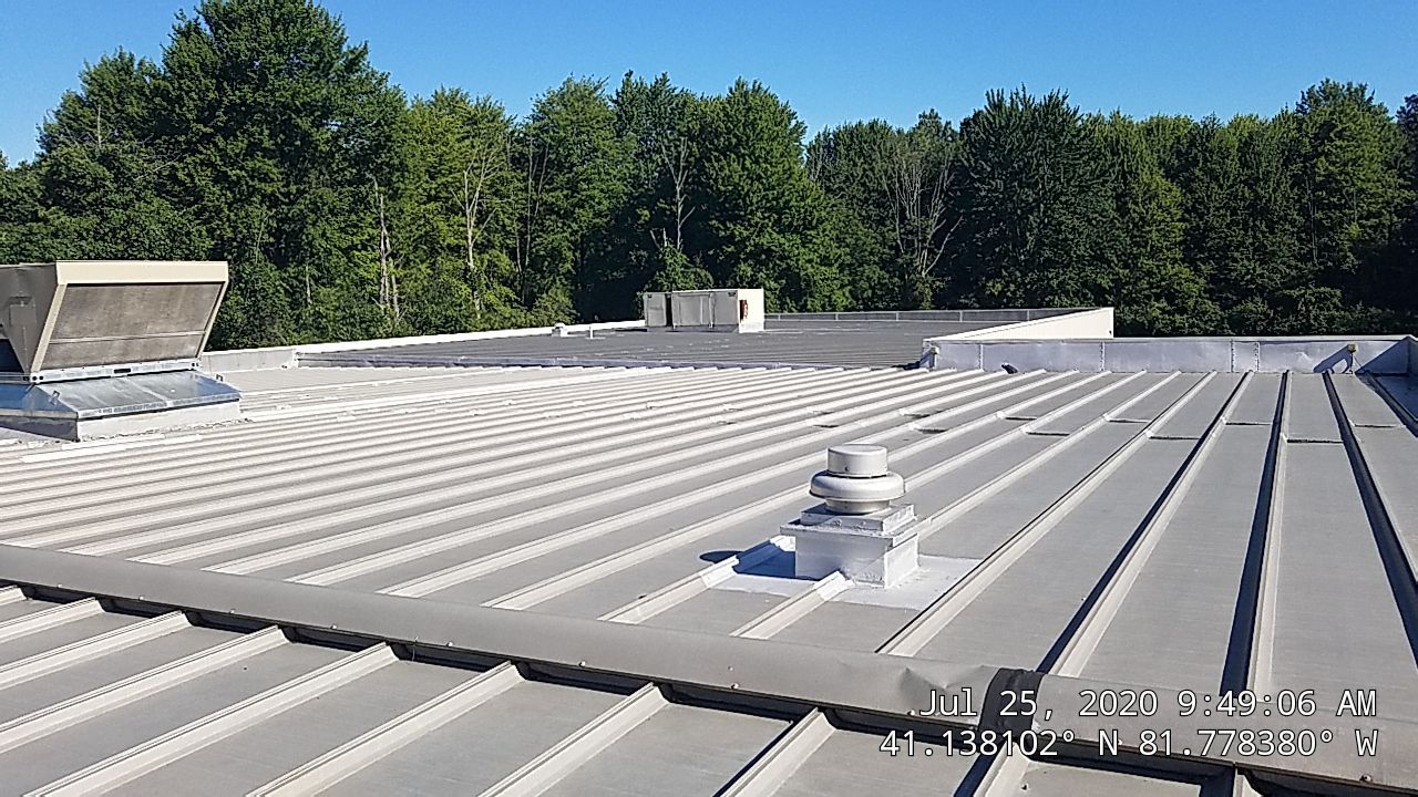 Commercial Metal Roof Coating by Gold Star Roofing LLC