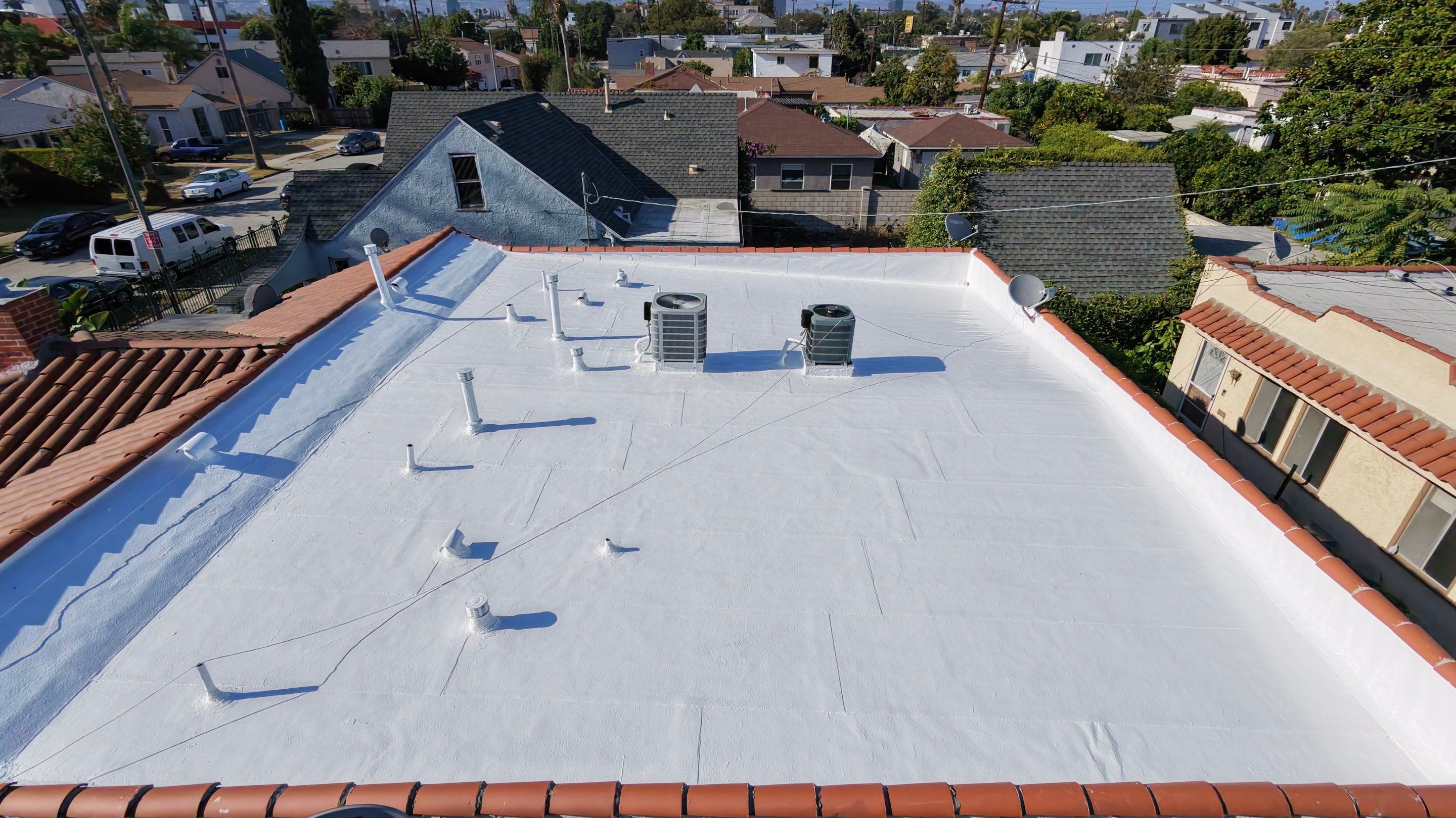 Los Angeles Flat Roof Restoration with White Reflective Coating by Hull Brothers Roofing