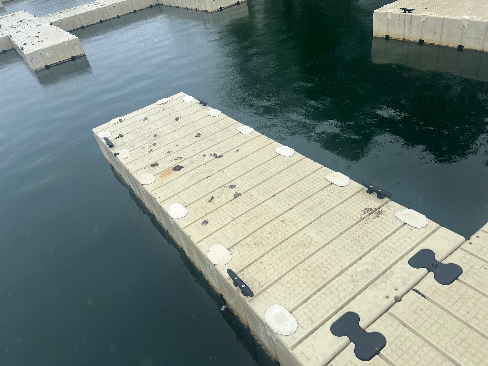 Power washing of floating dock by Northern Power Washing LLC.