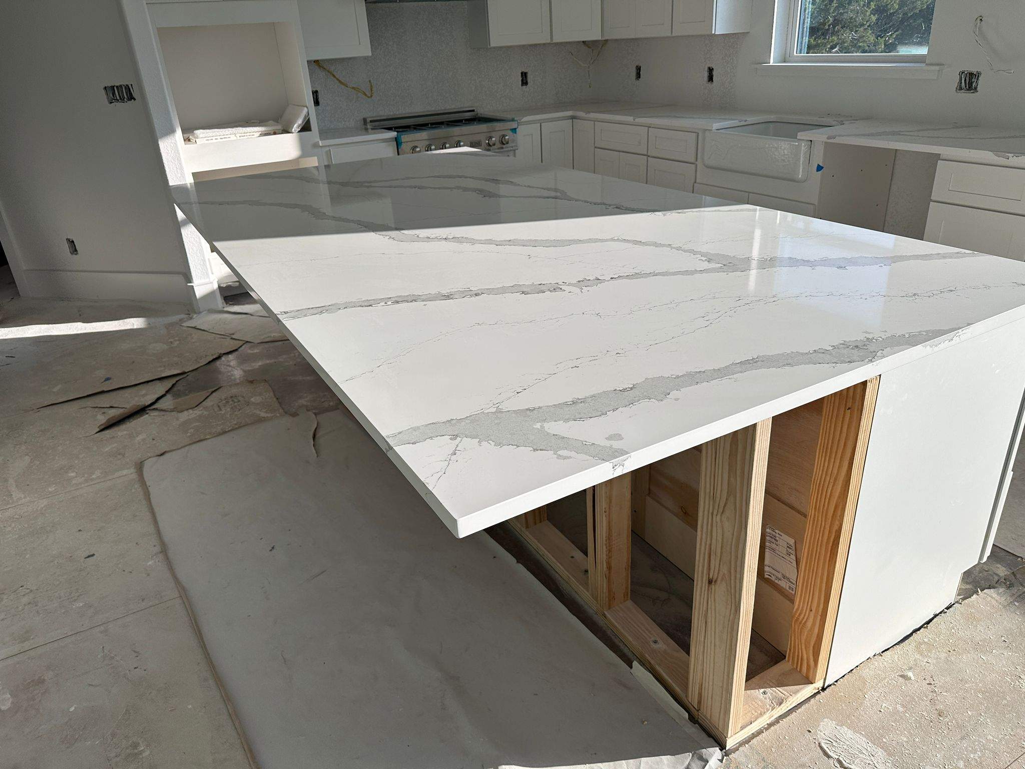 Kitchen and Bathroom Countertop Upgrades Featuring Gray Veined Quartz by Mena stone surfaces