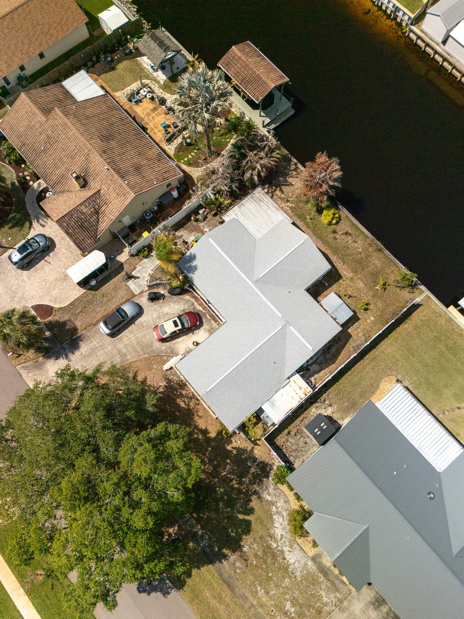 Merritt Island Roof Replacement Featuring Tamko Titan Glacier White Shingles by Wiedmann Construction & Roofing