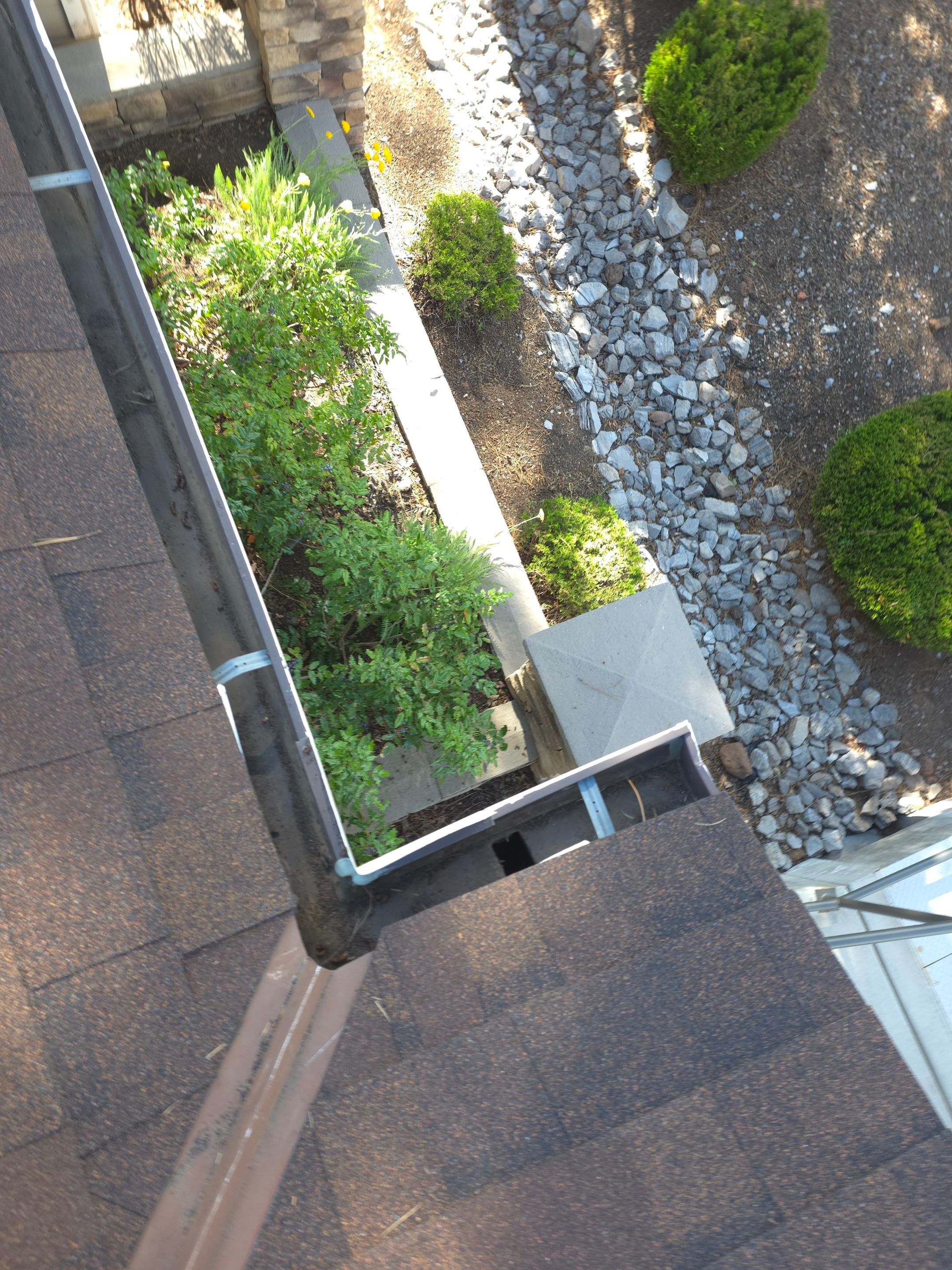 HOA gutter cleaning in Flagstaff, AZ after photo showing full gutters.