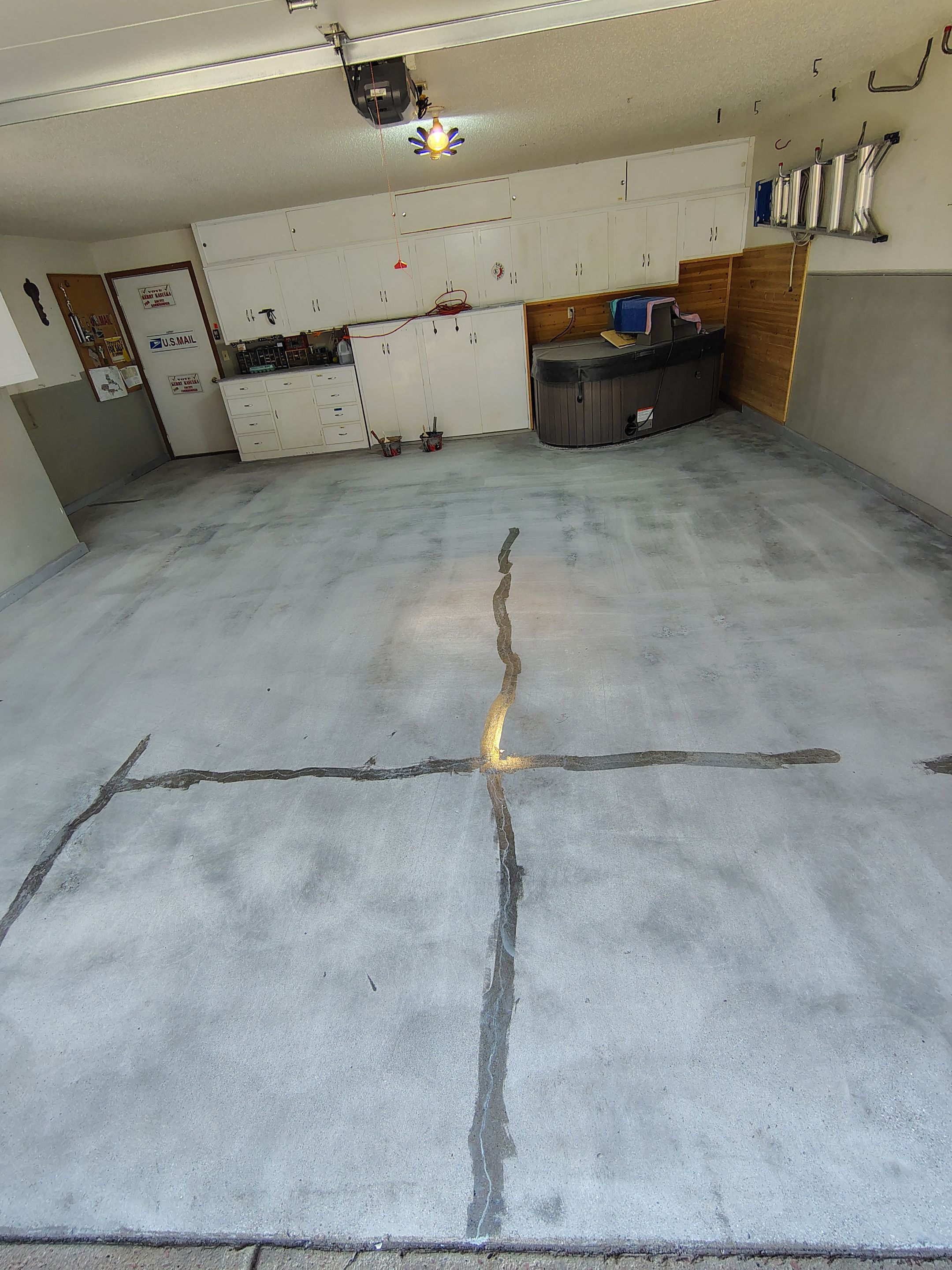 Domino Flake Garage Floor Coating Installation in Sioux Falls by Select Painting, Coatings & Garage Cabinets