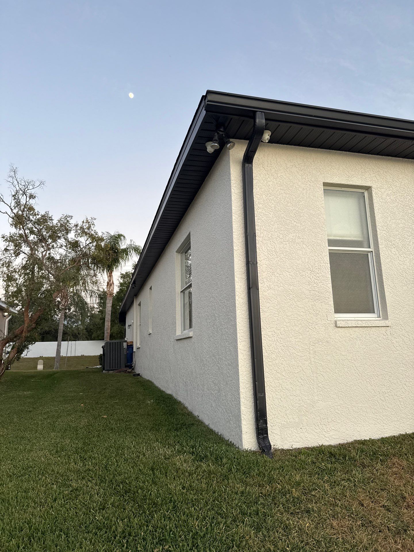 Black Aluminum Gutters with Matching Downspouts in Tampa FL by Gutter Professors