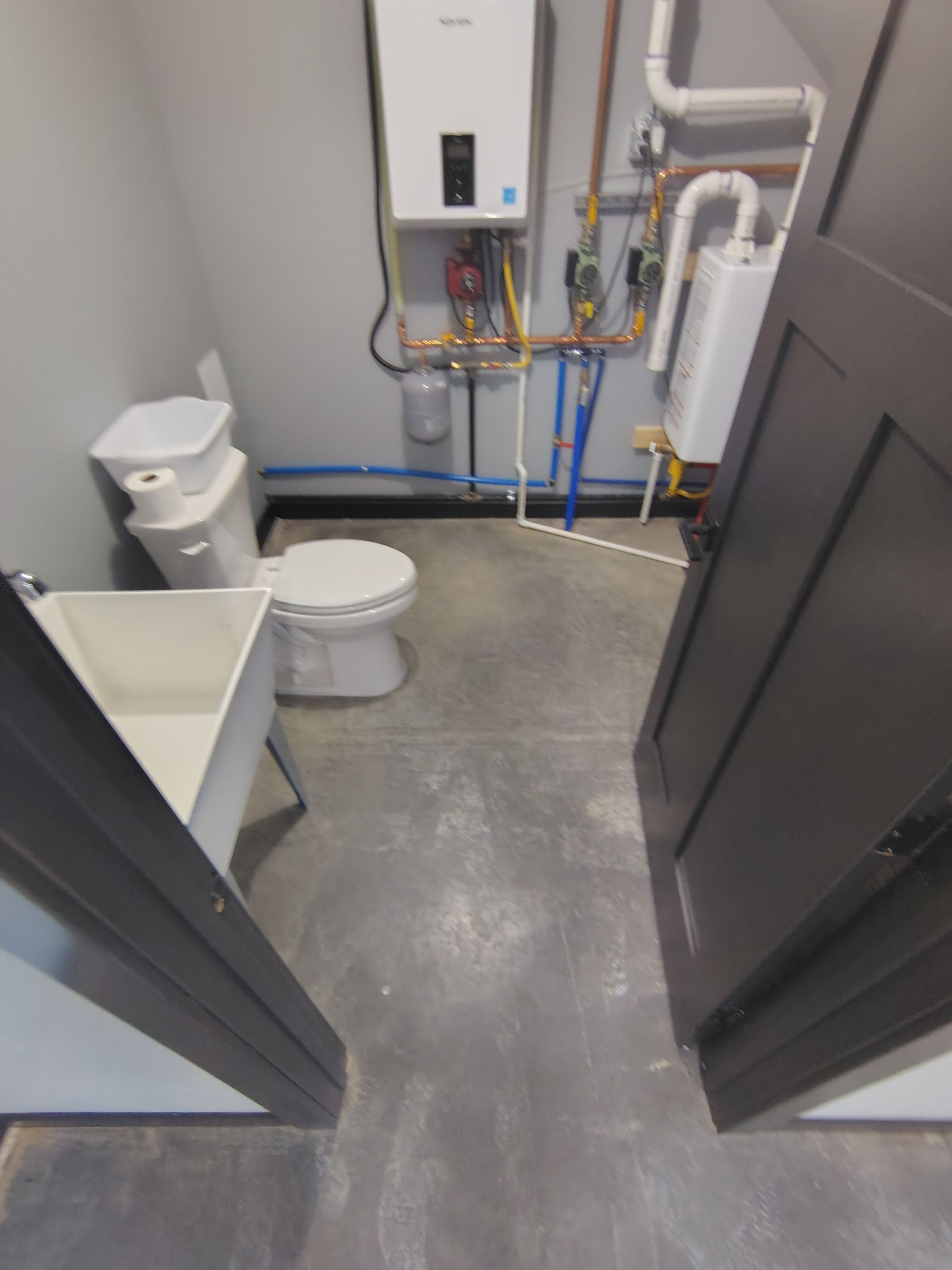 Polyaspartic Garage Floor Coating with Decorative Flake in Wentworth by Select Painting, Coatings & Garage Cabinets