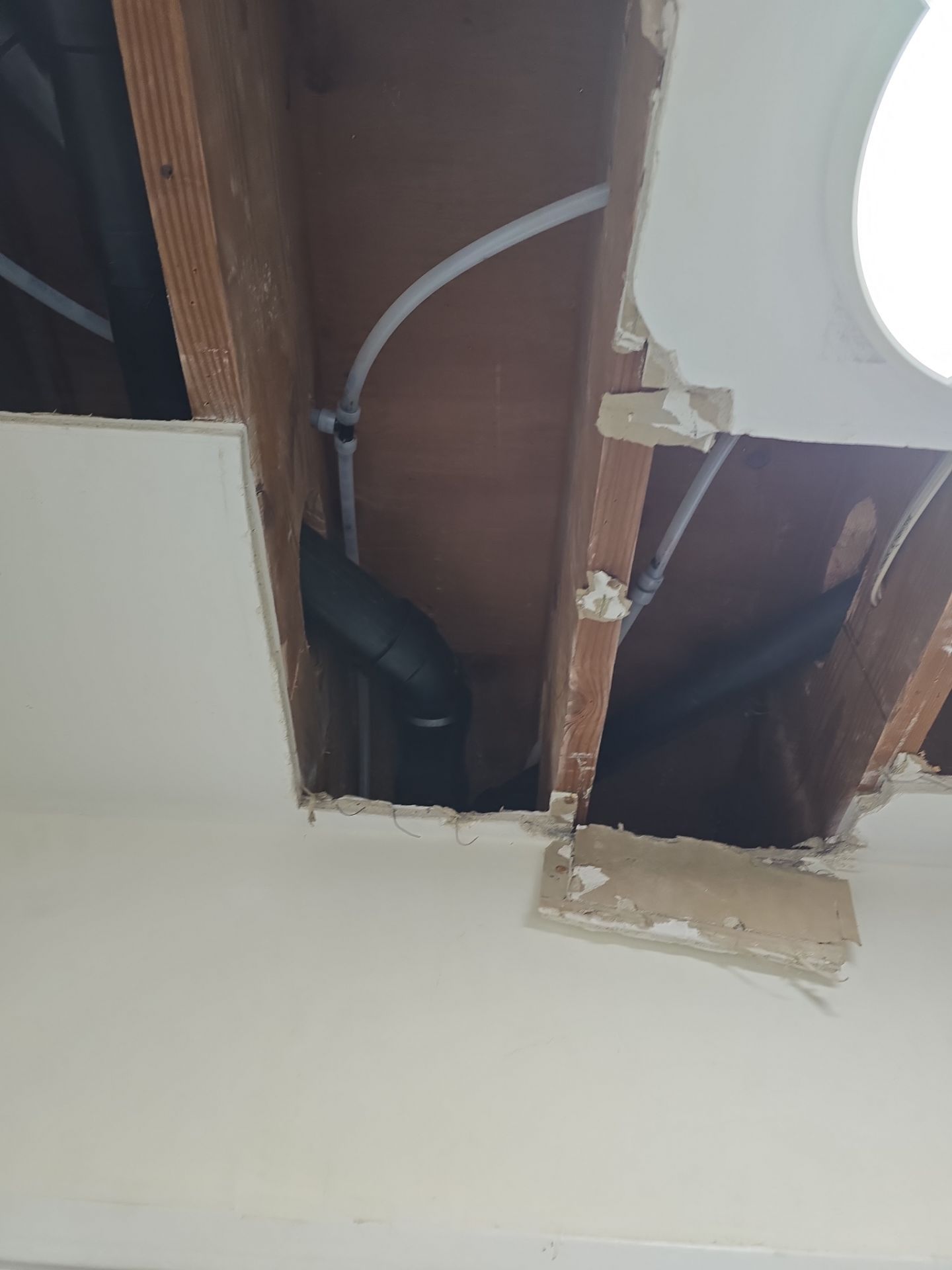Installation of New Tall Black Piping (Wall to Ceiling) & Underground Piping by Us Plumbing