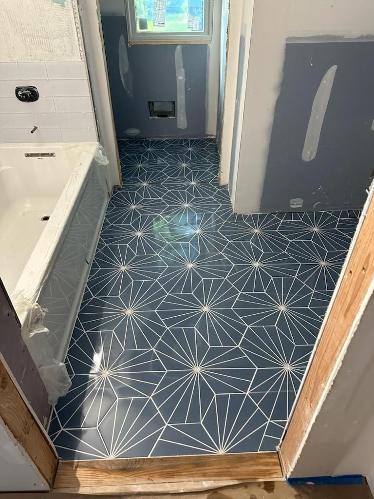 Jack & Jill Bathroom Floor + Dog Washing Nook with Niche using Porceline Subway Tile by Footprints Floors Morristown