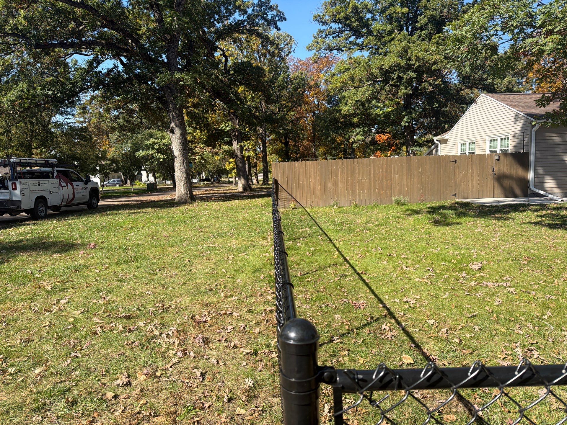 Residential Black Chain Link Fencing in Cedar Falls by Perfect Picket Fence and Stain