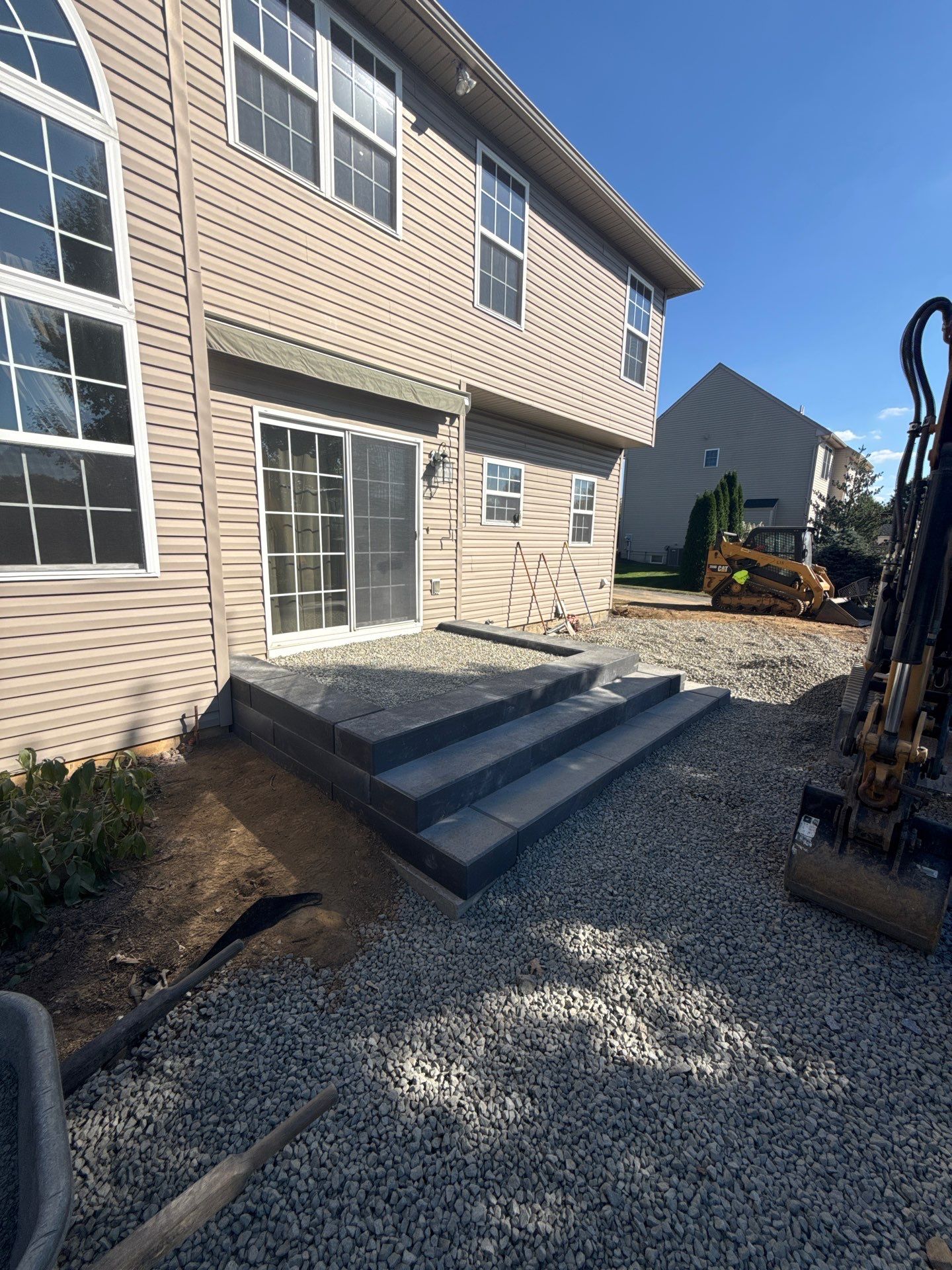 Backyard Retreat: Techo-Bloc Patio + Firepit Lounge by Saylor’s Lawn & Landscape