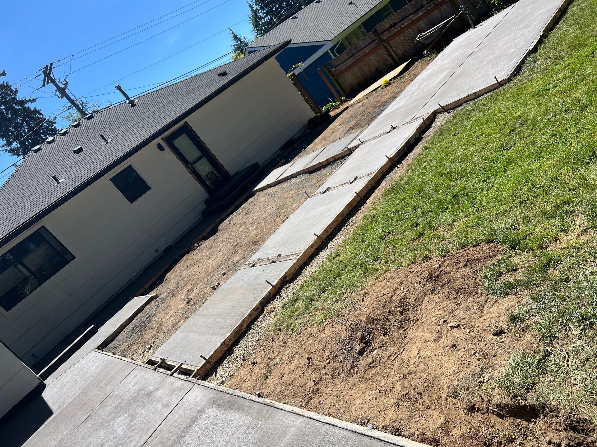 John | Concrete Backyard Walkway by Jireh Asphalt & Concrete Inc 