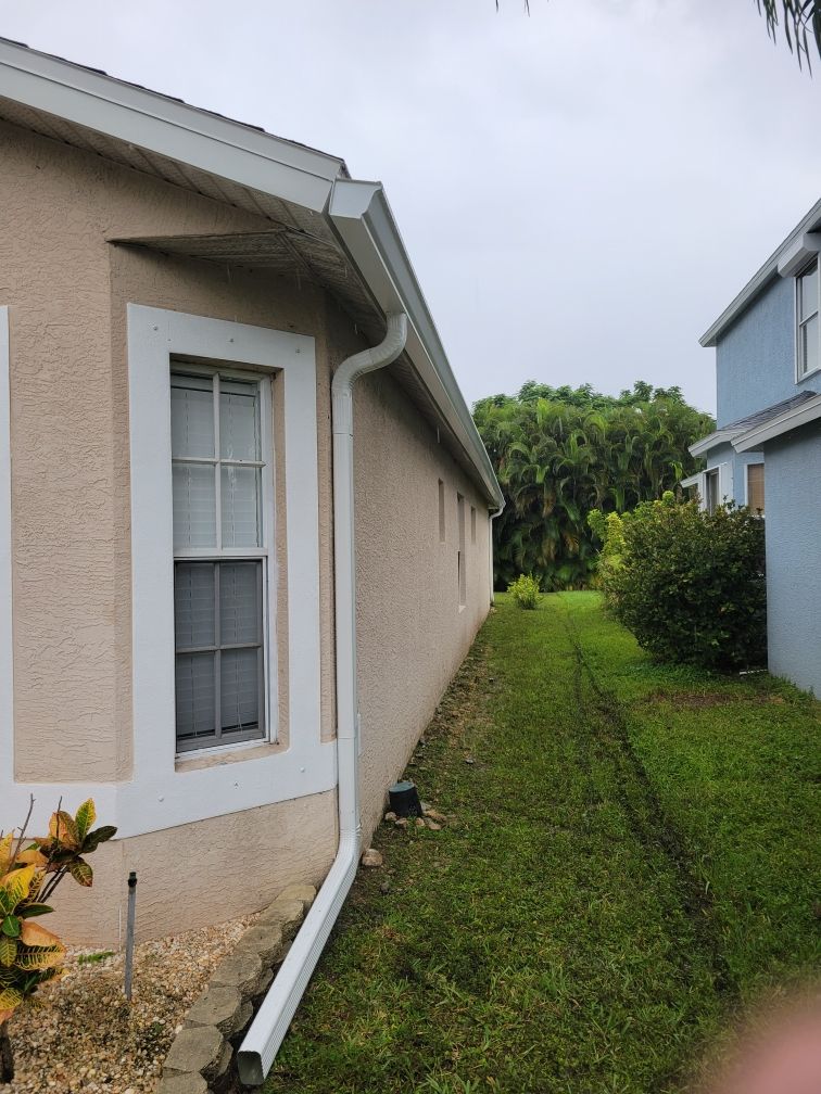 White Aluminum Seamless Gutters and Downspouts in Estero FL by Gutter Professors
