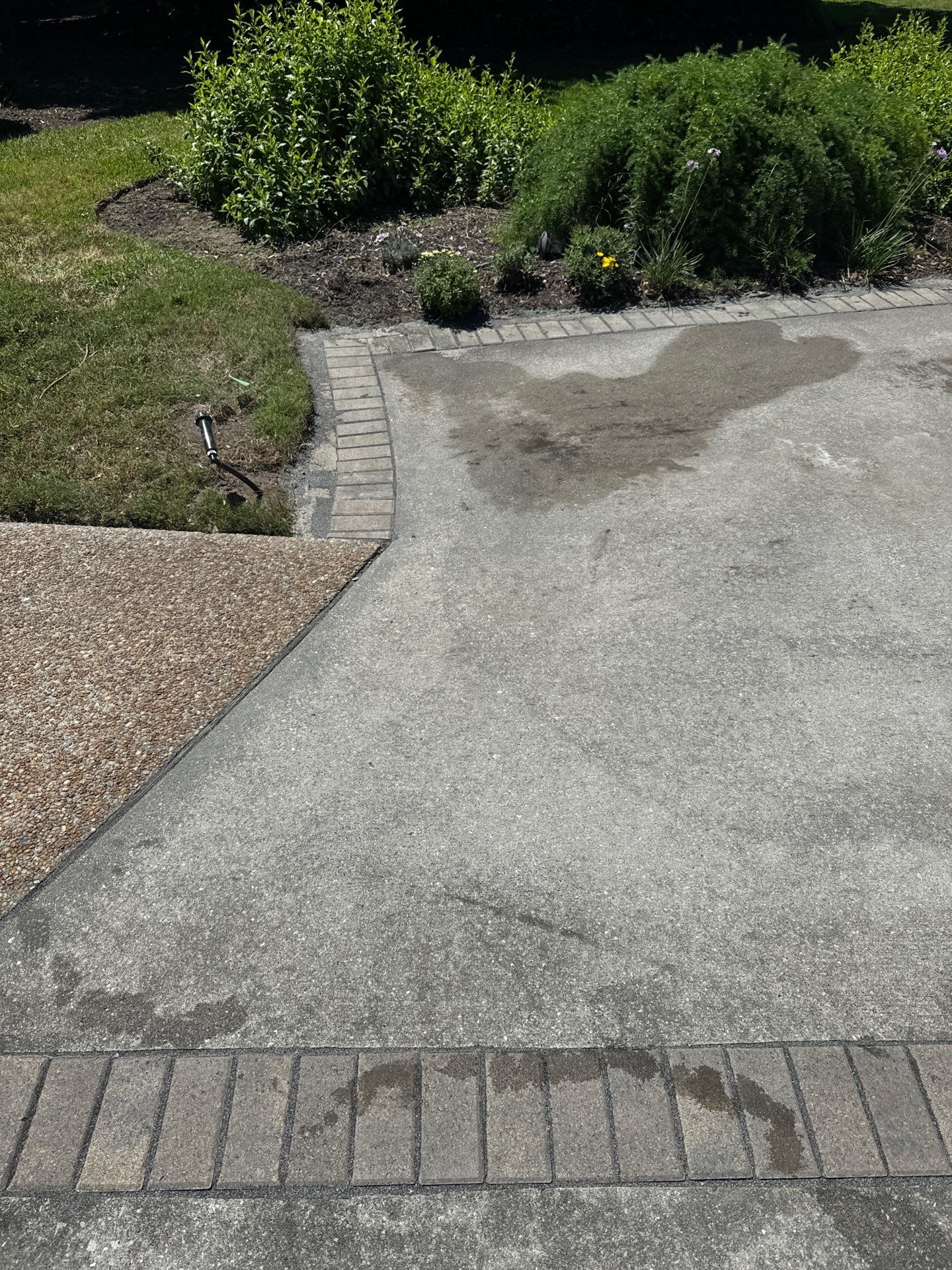Concrete Driveway Repair with Decorative Paver Accents in Hilton Head Island by Lowcountry Scapes, LLC