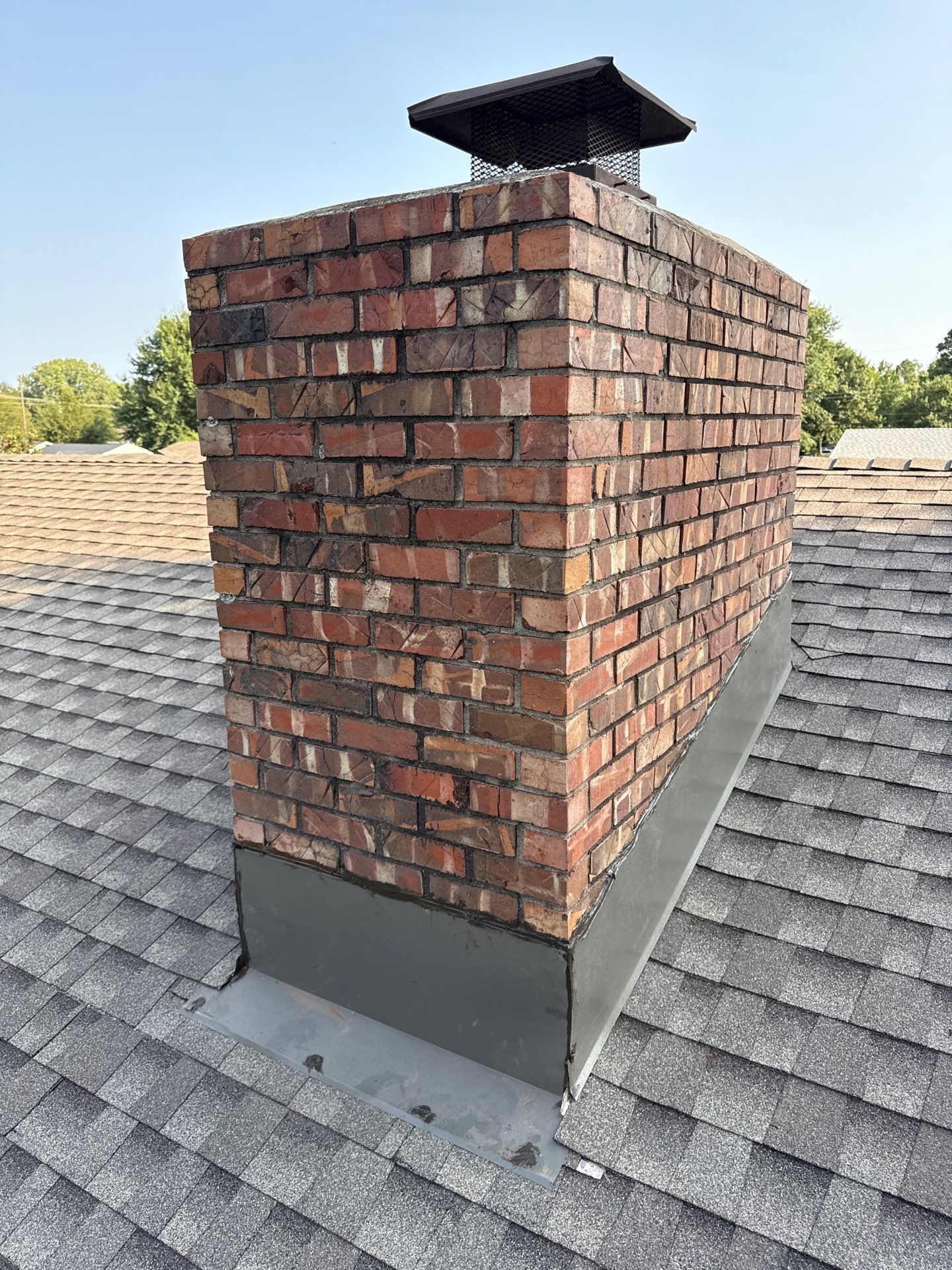 roof replacement, and chimney flashing replacement in Norman by McCann's Roofing and Construction