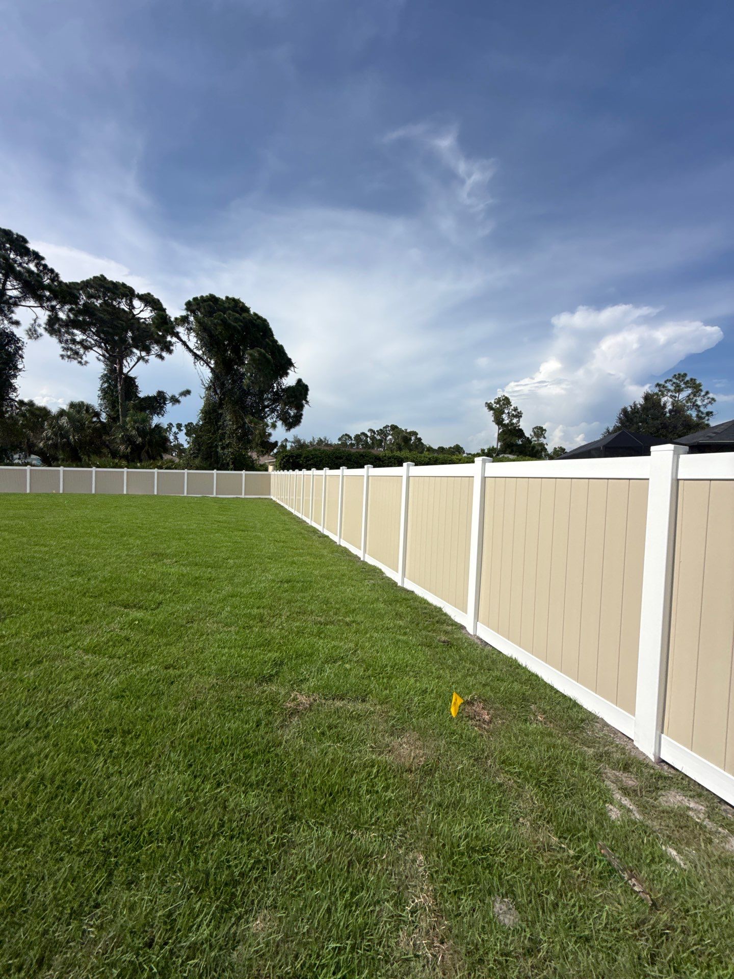 Custom Two-Tone Vinyl Privacy Fence Installation in North Port by True Fence LLC