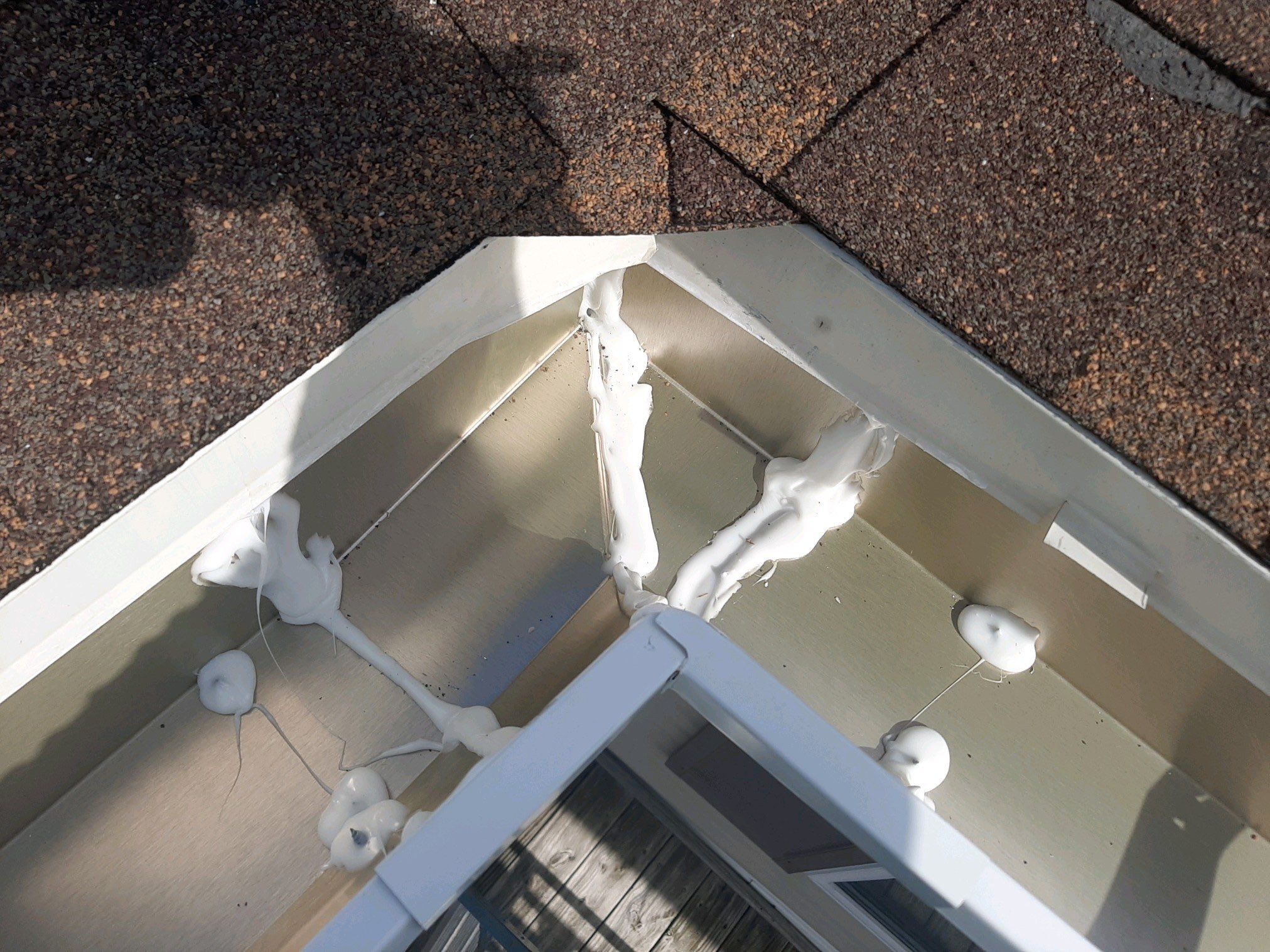 Gutter Installation using White Seamless Gutters by Gutter Professors