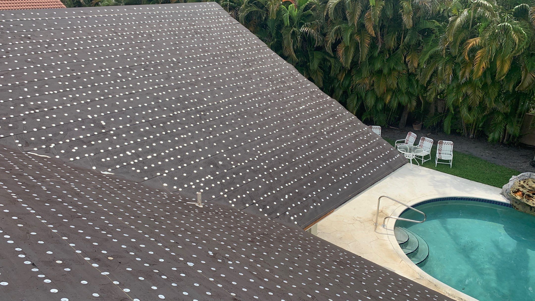 Residential Roofing Installation using 1" Nail strip metal roof by BLUES BROTHERS CONSTRUCTION CORP