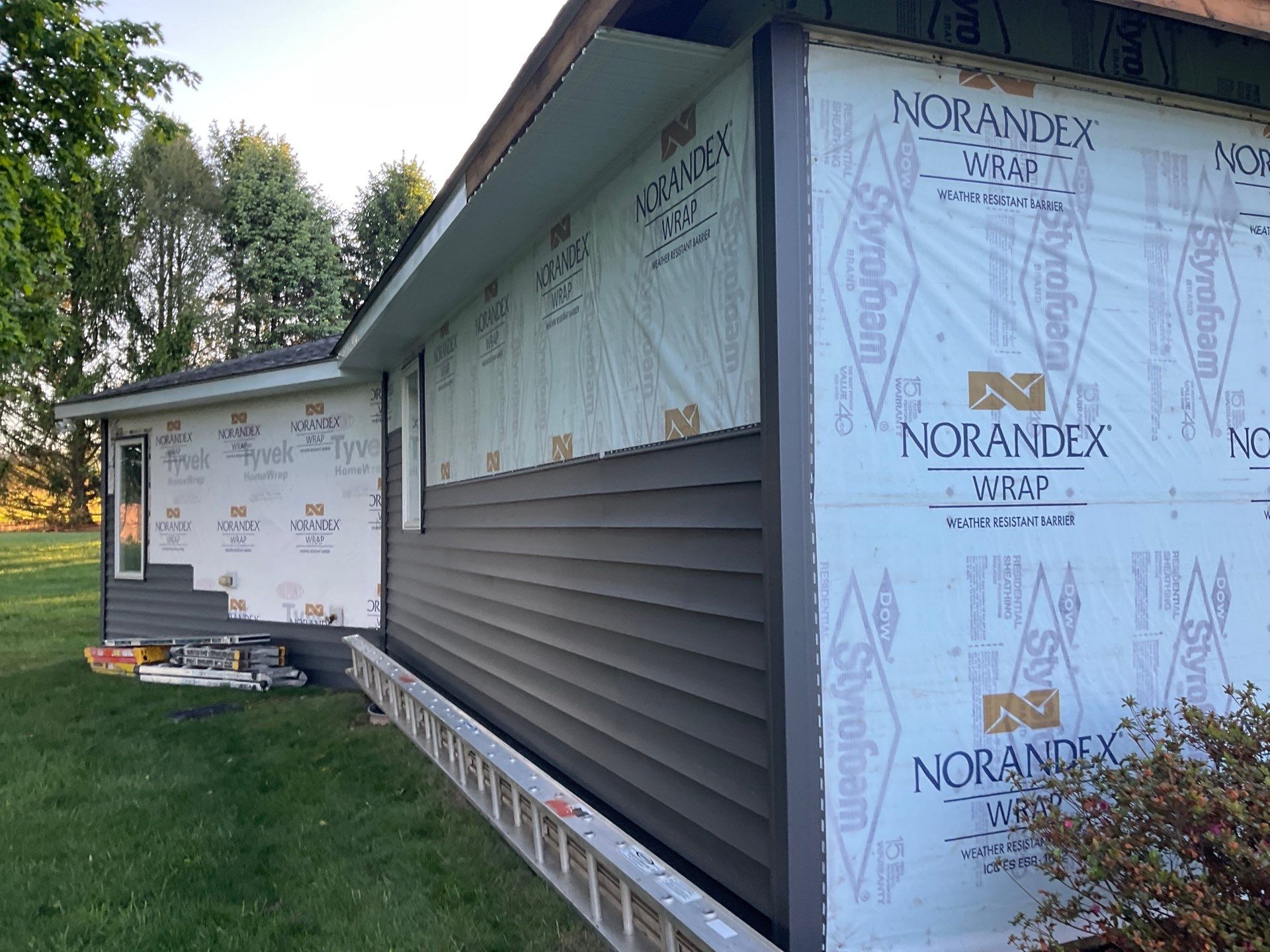 Nightfall Exterior Siding Replacement and Stone Veneer in Halifax by Esh Builders