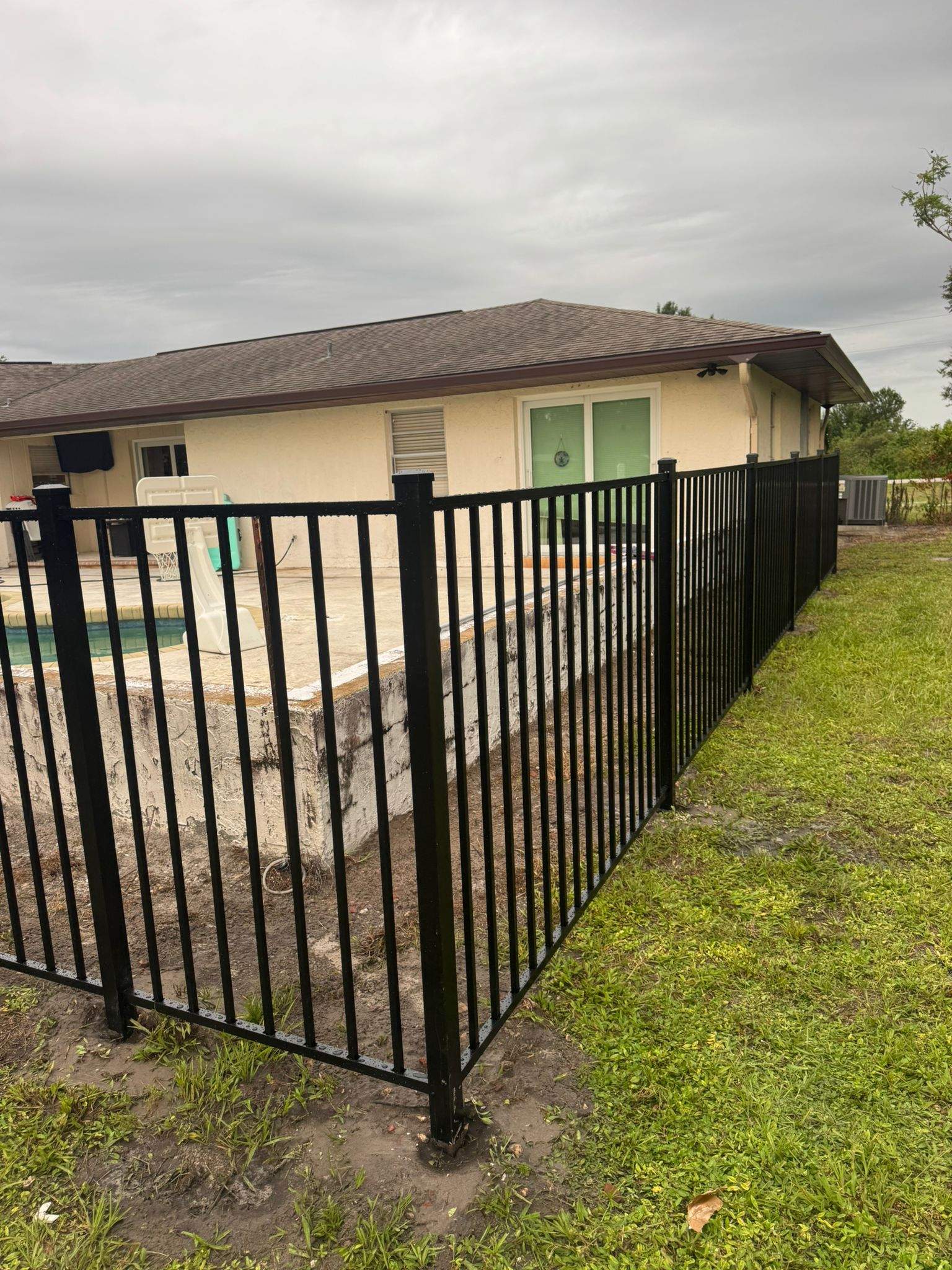 Black Aluminum Pool Safety Fence Installation in Punta Gorda by True Fence LLC