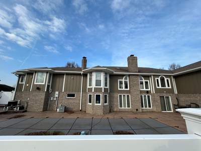 Steubenville Exterior Renovation Featuring Vertical Siding and Stone Accents