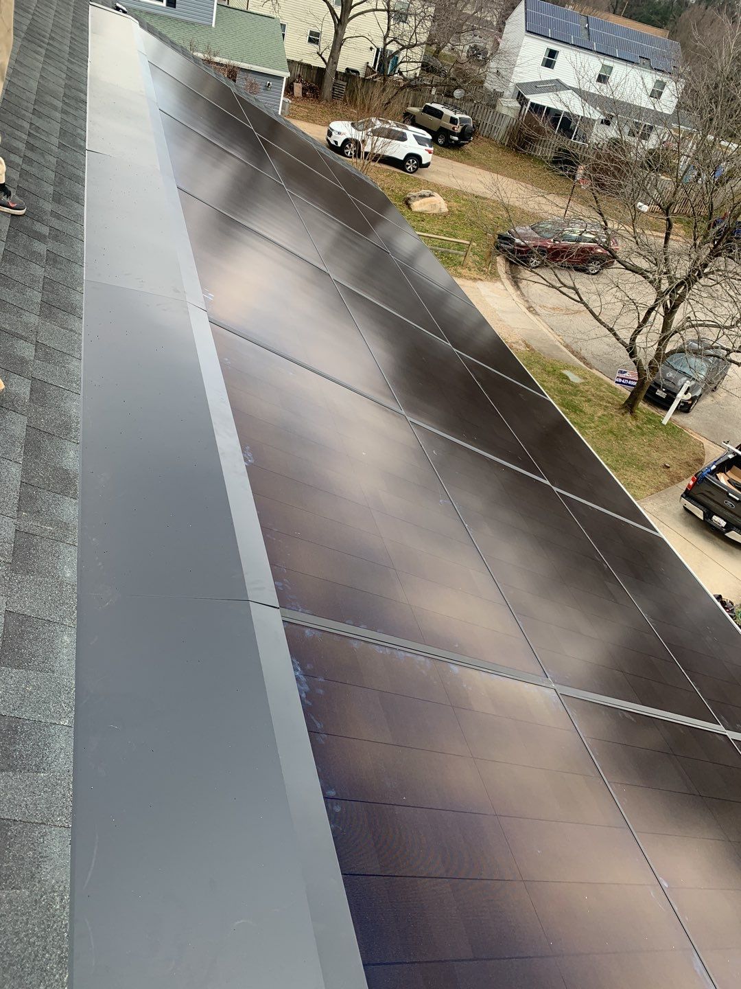 Roof Replacement with GAF Decotech integrated solar panels by American Home Contractors