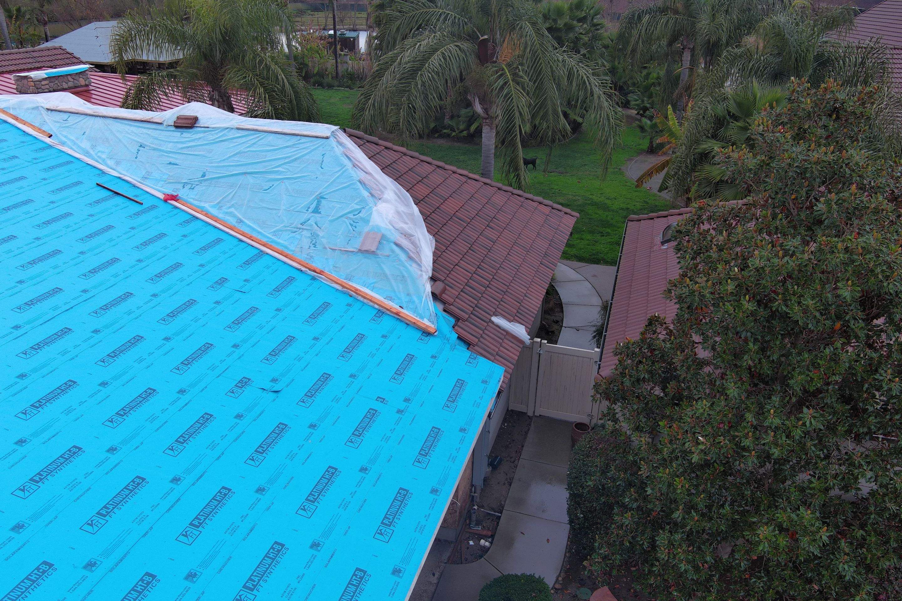 Tile, Metal, and TPO roofing project (new construction) by Straight Edge Roofing Inc