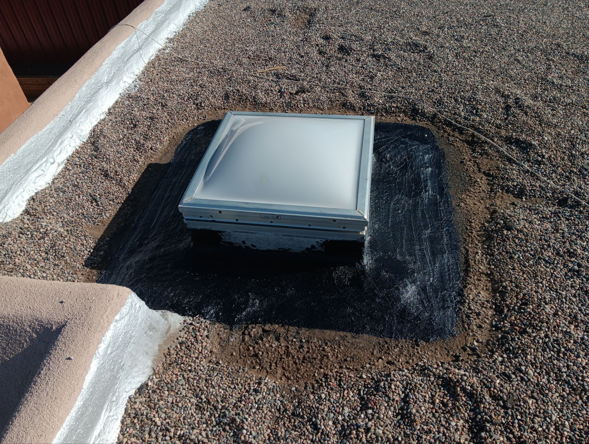 Roof Maintenance and Low-E Tempered Glass Skylight Replacement on Gravel Roof in Northwest Albuquerque by Doyle Roof Masters Inc