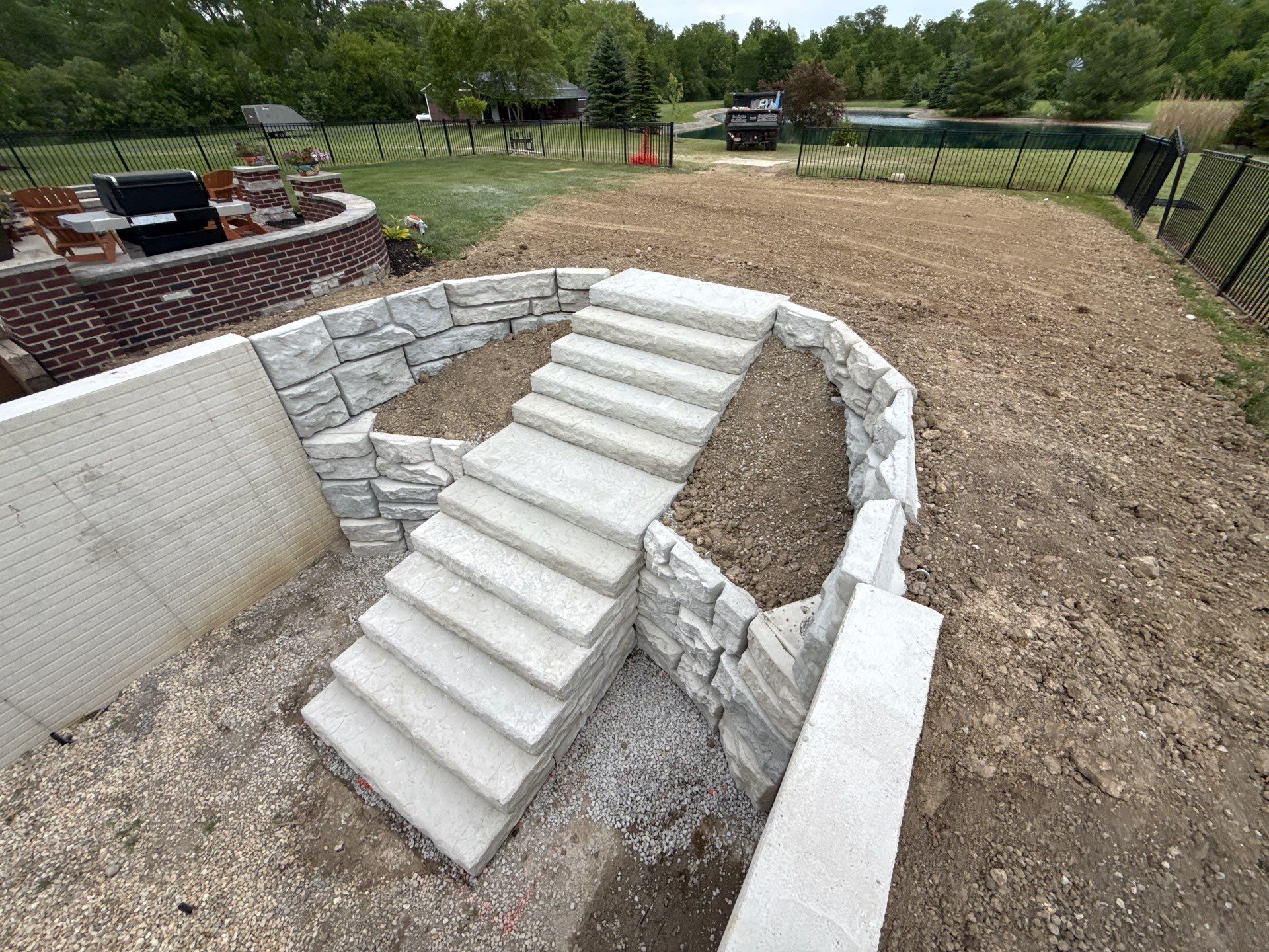 Basement Walkout Construction with Tiered Retaining Walls in Berkey by Farrell's Lawn & Garden Center LLC