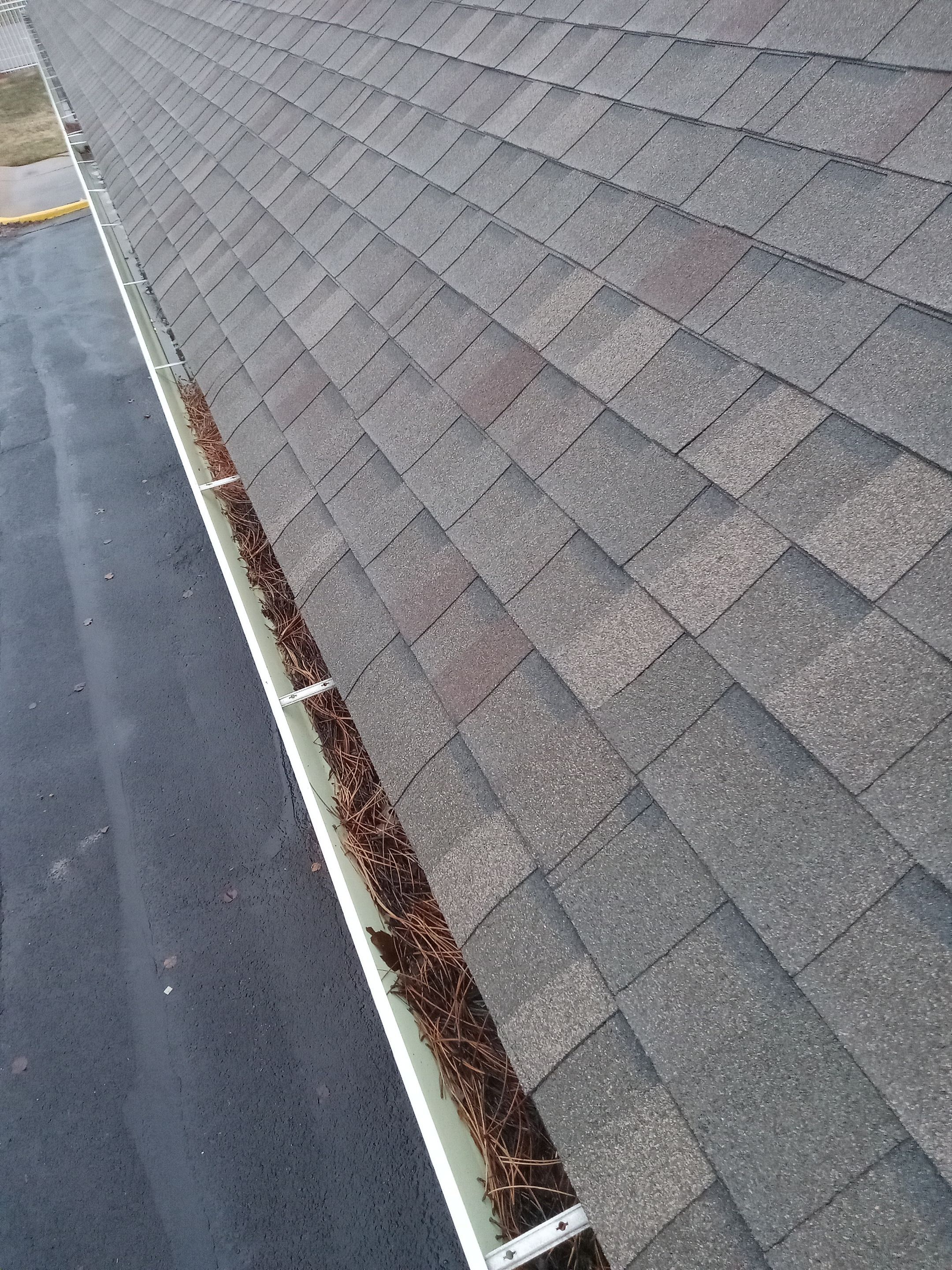 Commercial gutter cleaning Wichita before photo with filled gutters