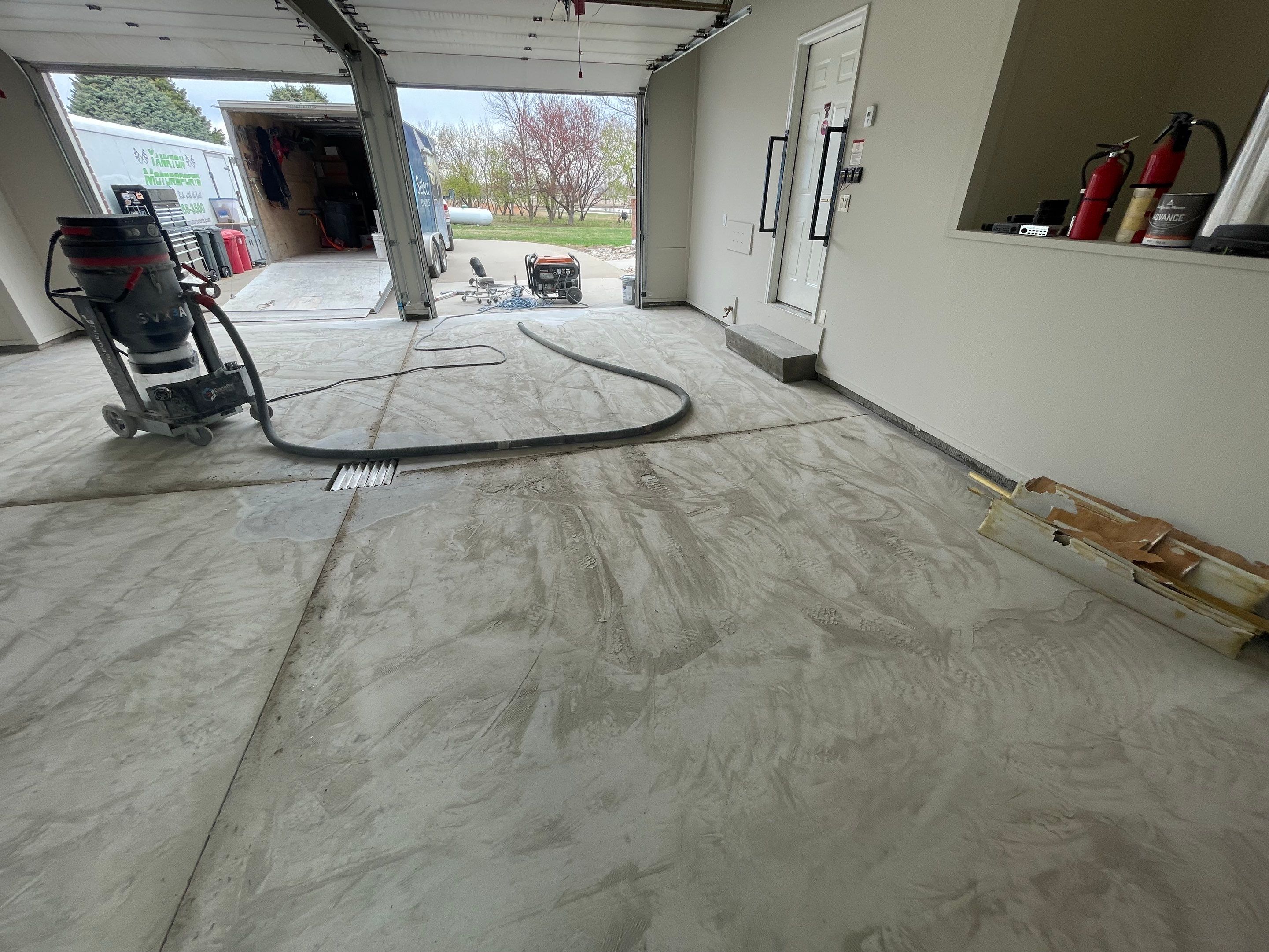 Garage transformation in Yankton by Select Painting, Coatings & Garage Cabinets