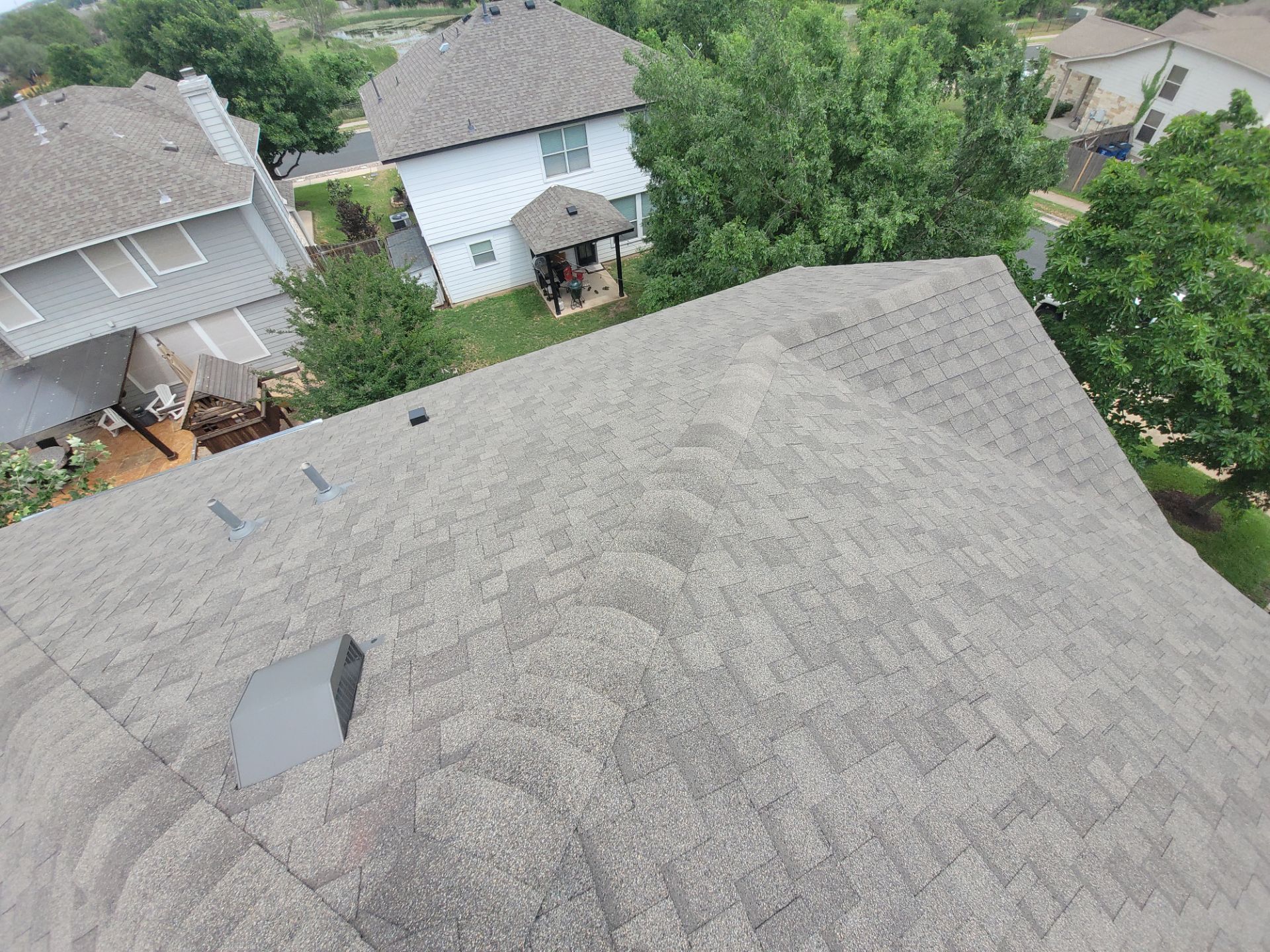 Residential Roofing Installation using IKO, Cambridge and gutters by Oakwood Roofing and Construction, LLC