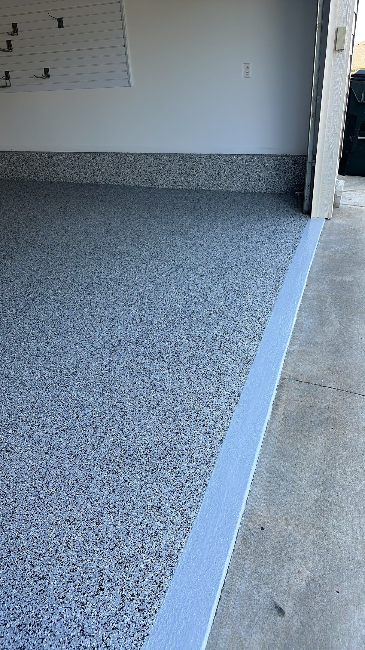 Sandy S. transformed her garage with a Banner Garage Floor and a cabinets by Banner Garage