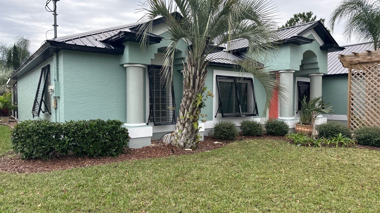 Bahama Shutters in Jet Black by Smart Guard Shutters