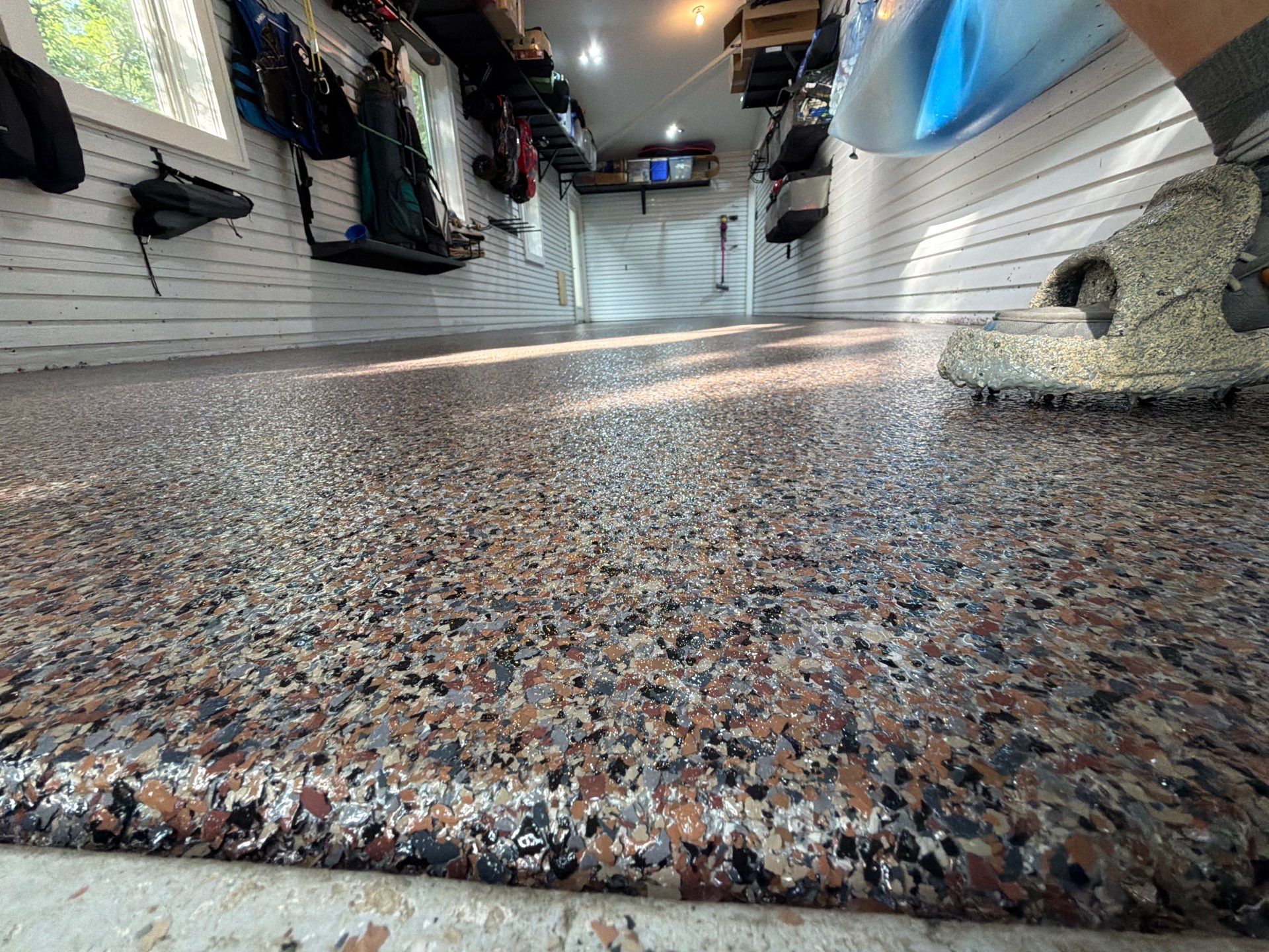 Residential Garage Epoxy Flake Floor Installation in Grand Haven by Gordon Painting