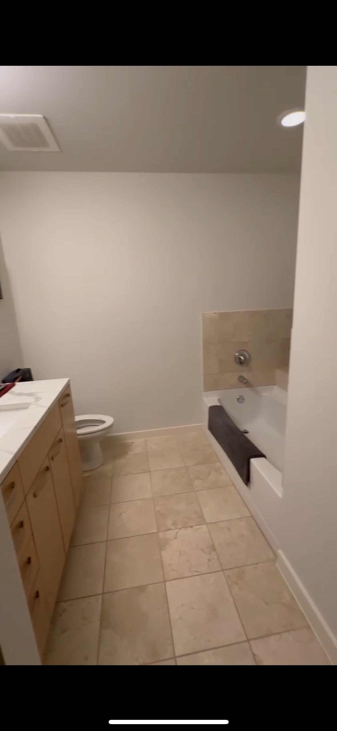 Modern Bathroom Transformation by Fine Line Flooring Inc.