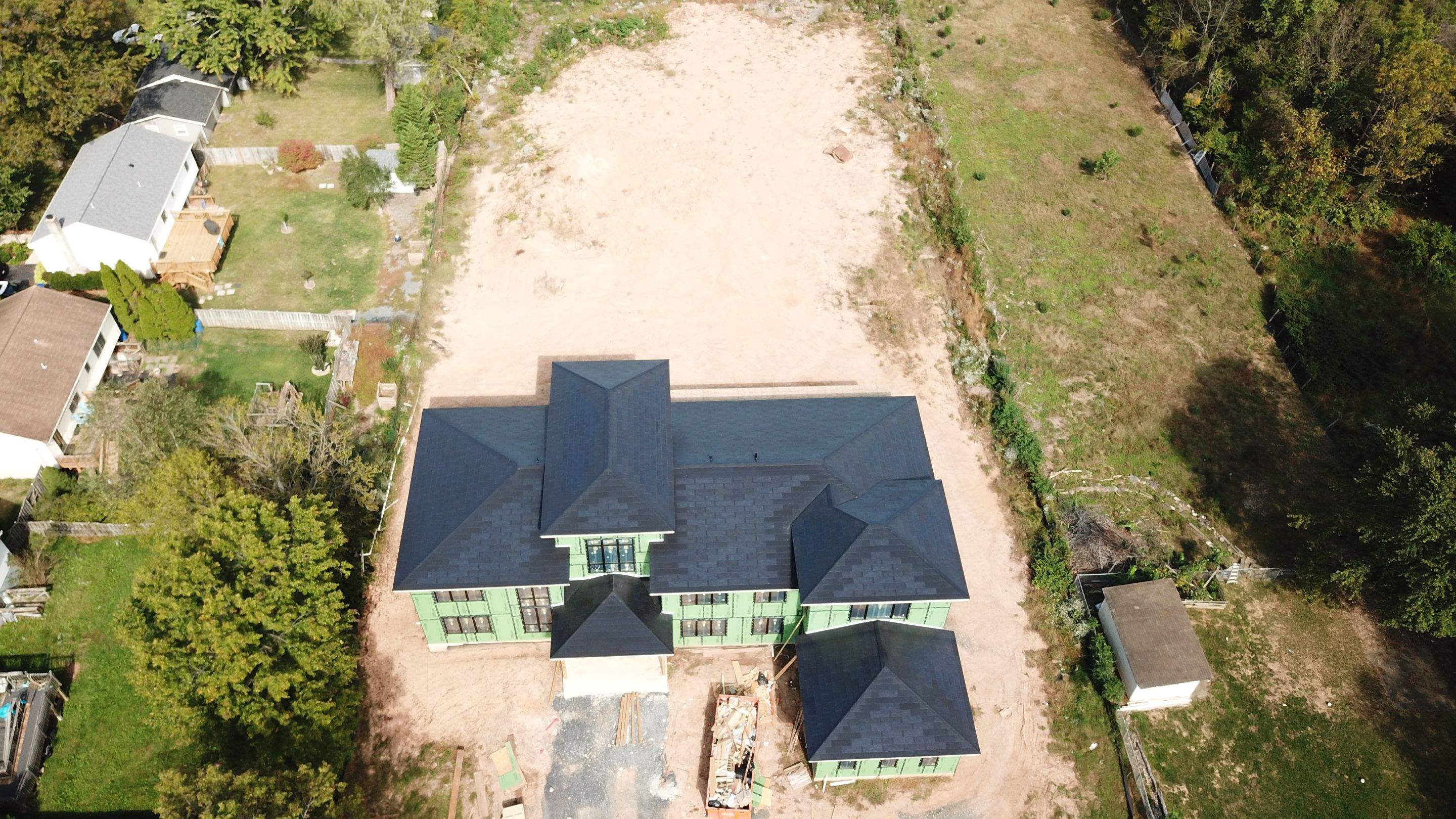 Tesla Solar Roof  using Tesla Solar Roof V3 tiles by American Home Contractors